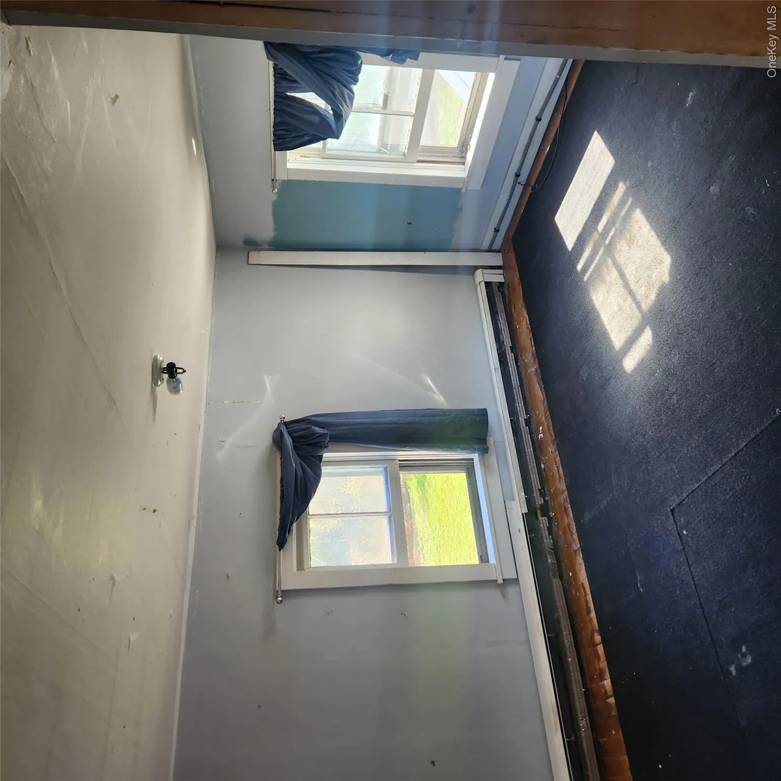 Spare room featuring a baseboard heating unit and healthy amount of natural light Spare room featuring a baseboard heating unit and healthy amount of natural light