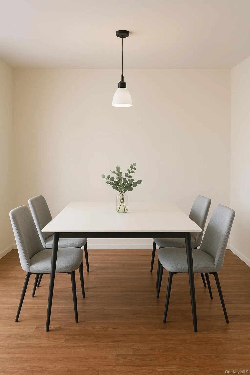 Dining room with light wood-style flooring and baseboards Dining room with light wood-style flooring and baseboards