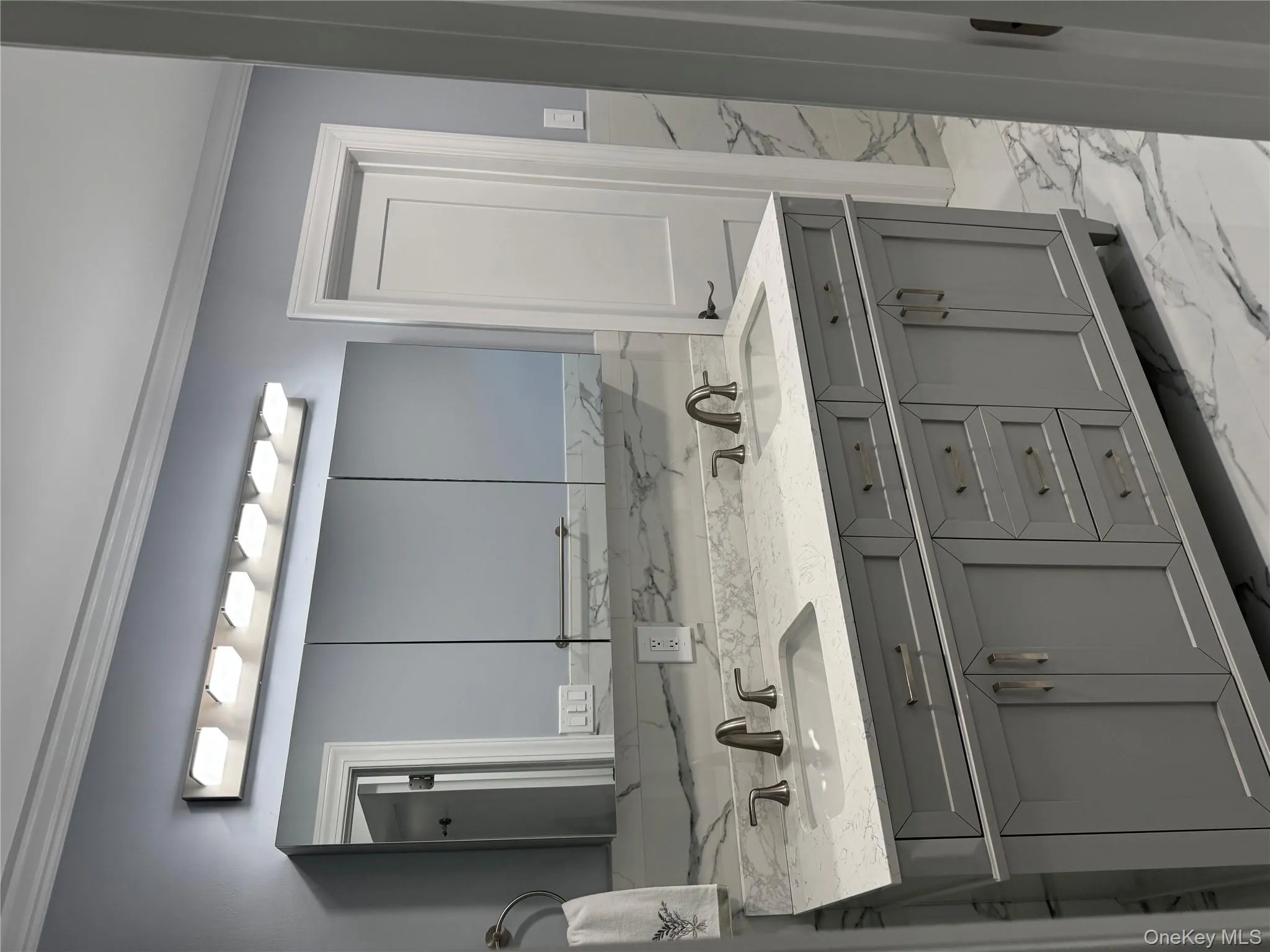 Bathroom with vanity light, porcelain floors, walls, double vanity, with plenty of storage. Bathroom with vanity light, porcelain floors, walls, double vanity, with plenty of storage.