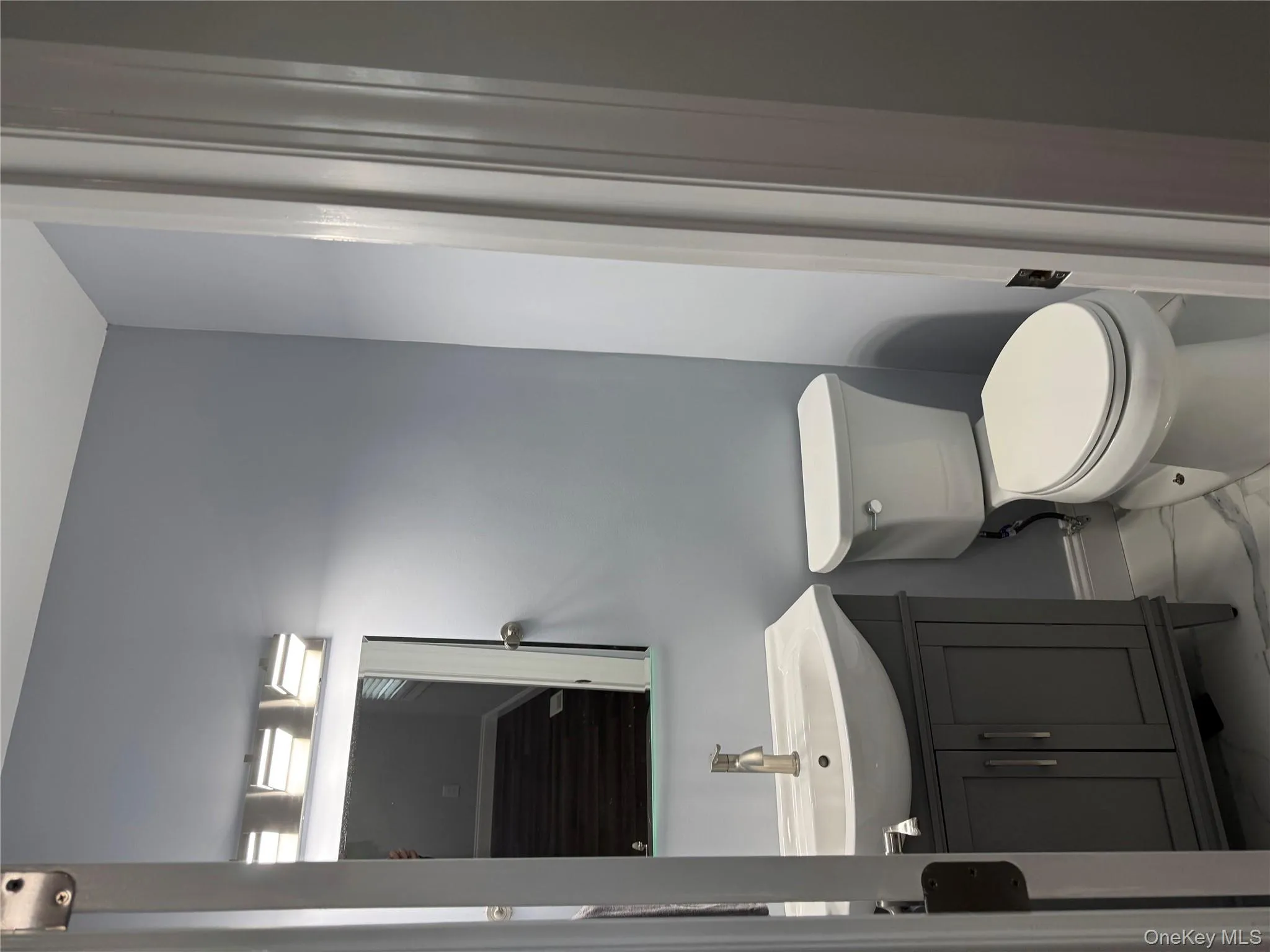 Half BathFeaturing: Vanity with Storage and Porcelain Flooring Half BathFeaturing: Vanity with Storage and Porcelain Flooring