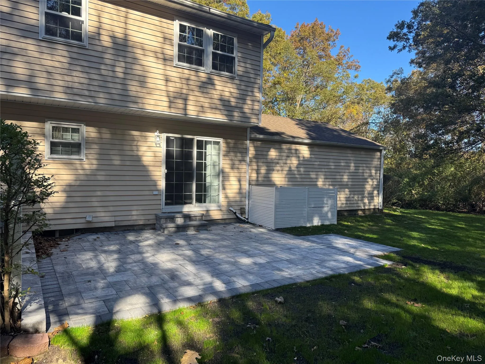 Rear view of property with a patio and designated BBQ Spot. Rear view of property with a patio and designated BBQ Spot.