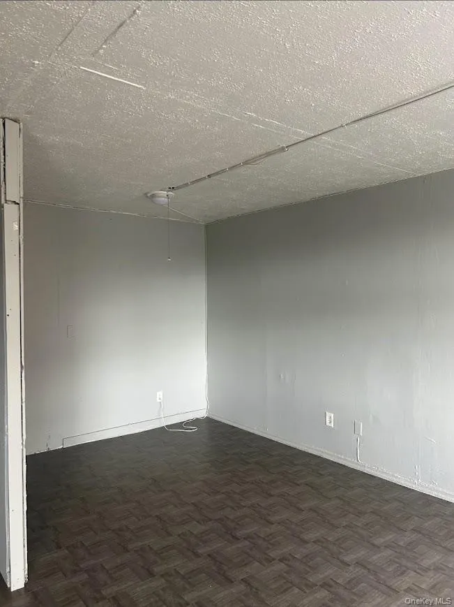 Empty room with baseboards Empty room with baseboards