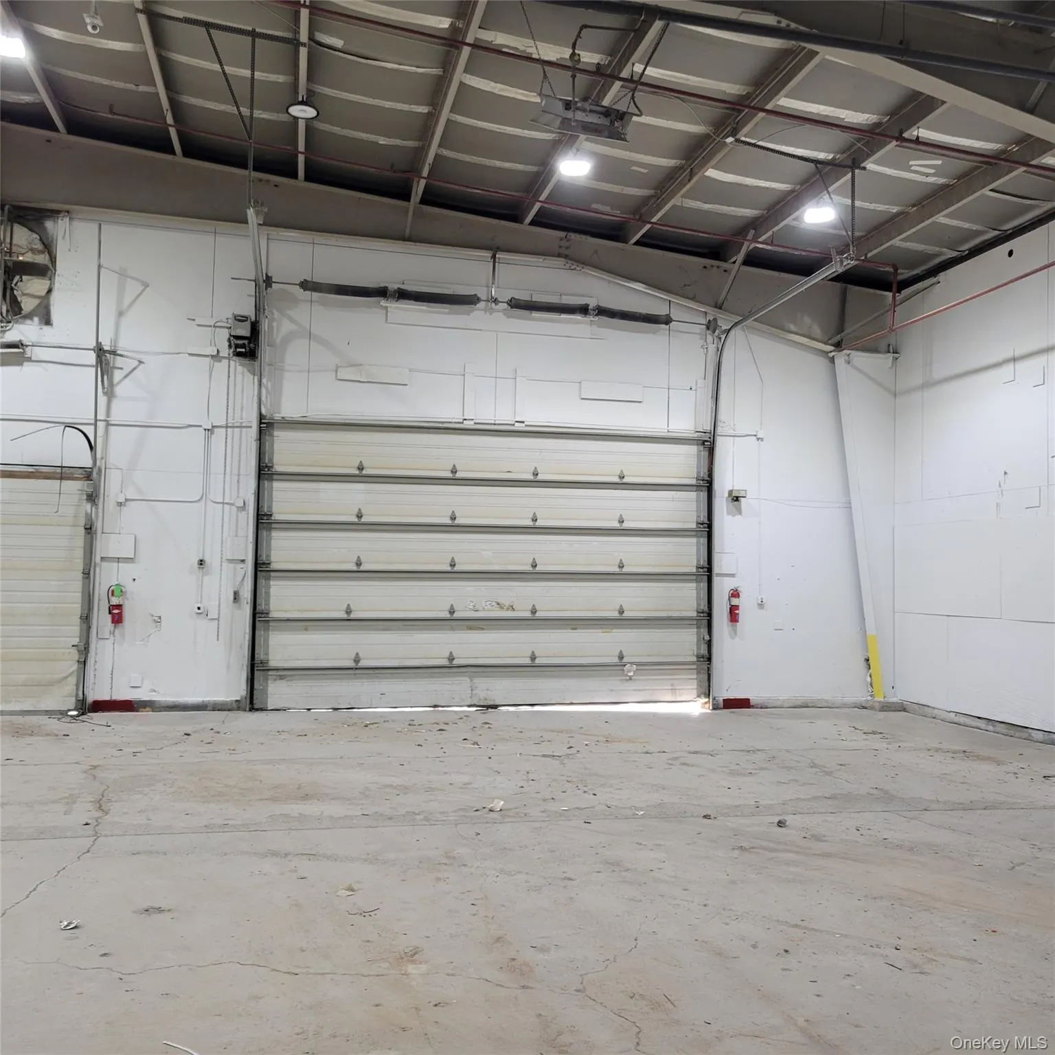 Garage featuring a garage door opener Garage featuring a garage door opener