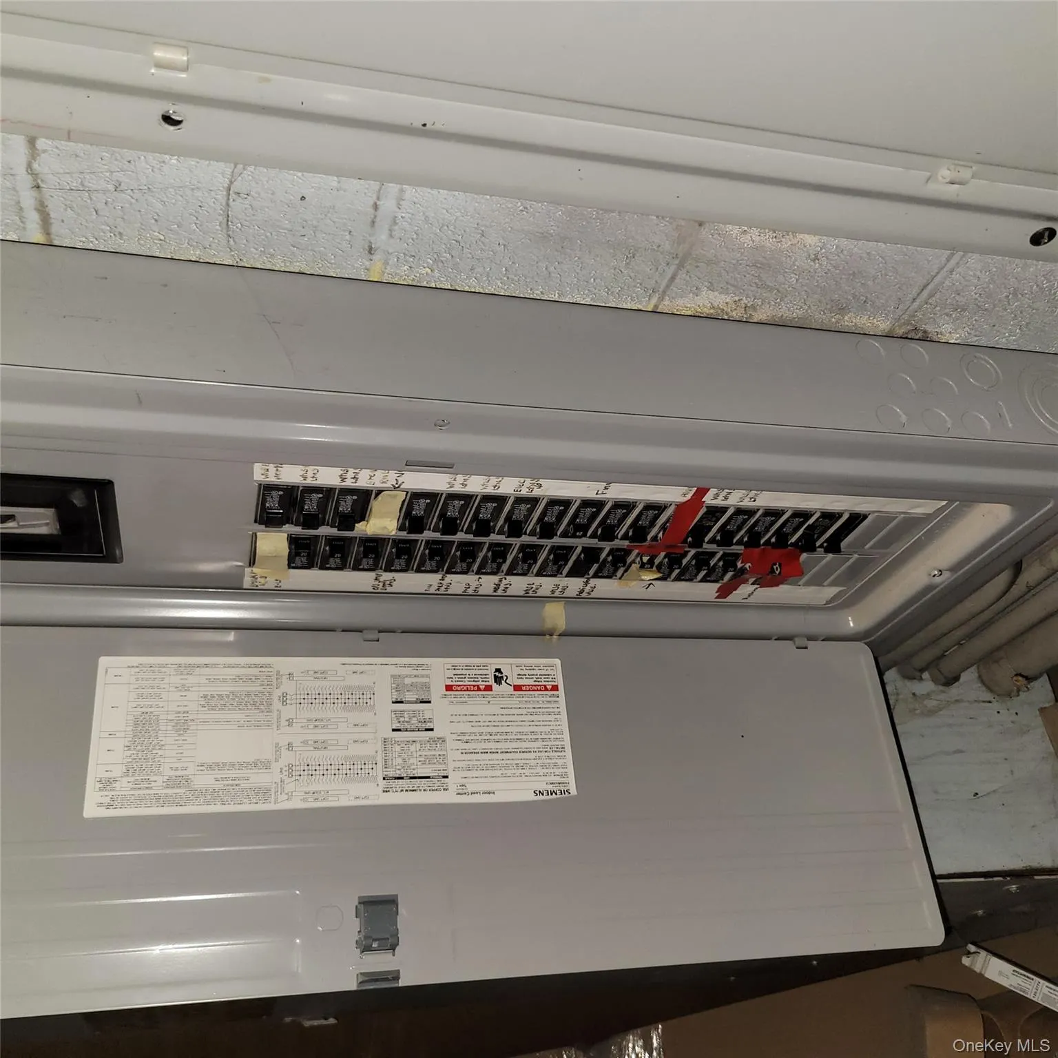 Utility room with electric panel Utility room with electric panel