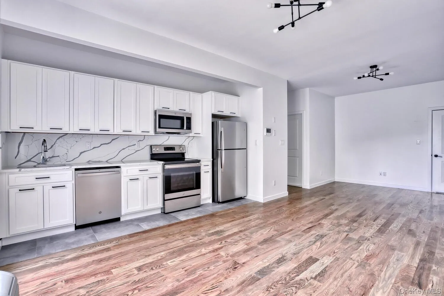 Beautiful Kitchens with white cabinets, stainless steel appliances, stone counters and decorative backsplash. Beautiful Kitchens with white cabinets, stainless steel appliances, stone counters and decorative backsplash.