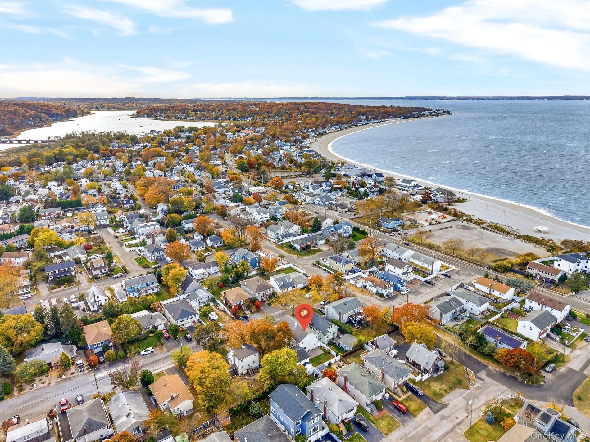 Aerial view of property and surrounding area with nearby suburban area Aerial view of property and surrounding area with nearby suburban area