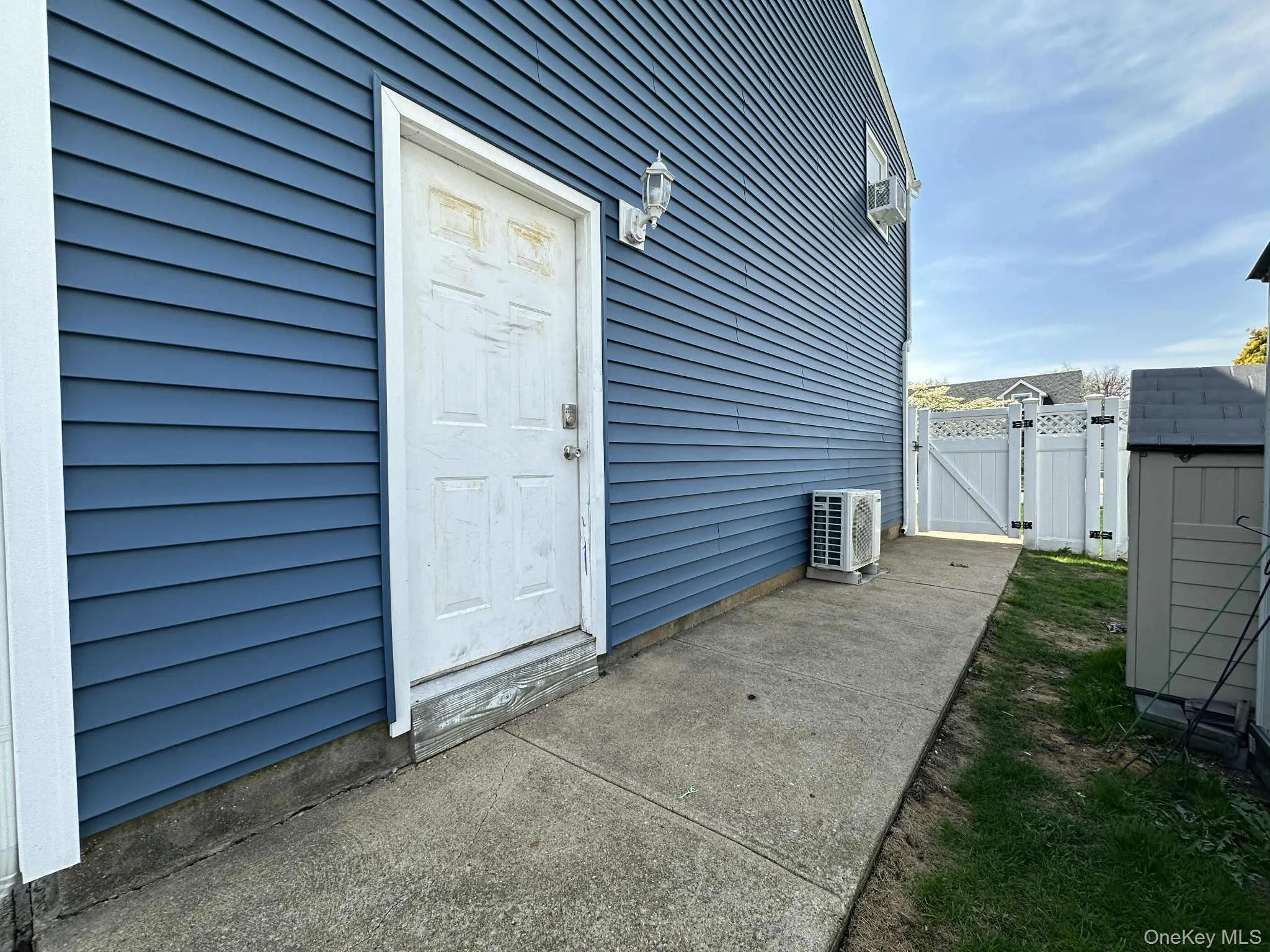 Property entrance with a gate and a patio area Property entrance with a gate and a patio area