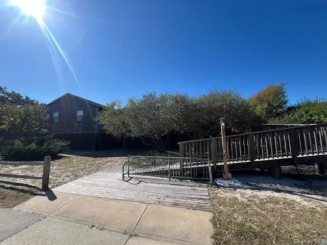 View of property's community featuring a wooden deck View of property's community featuring a wooden deck