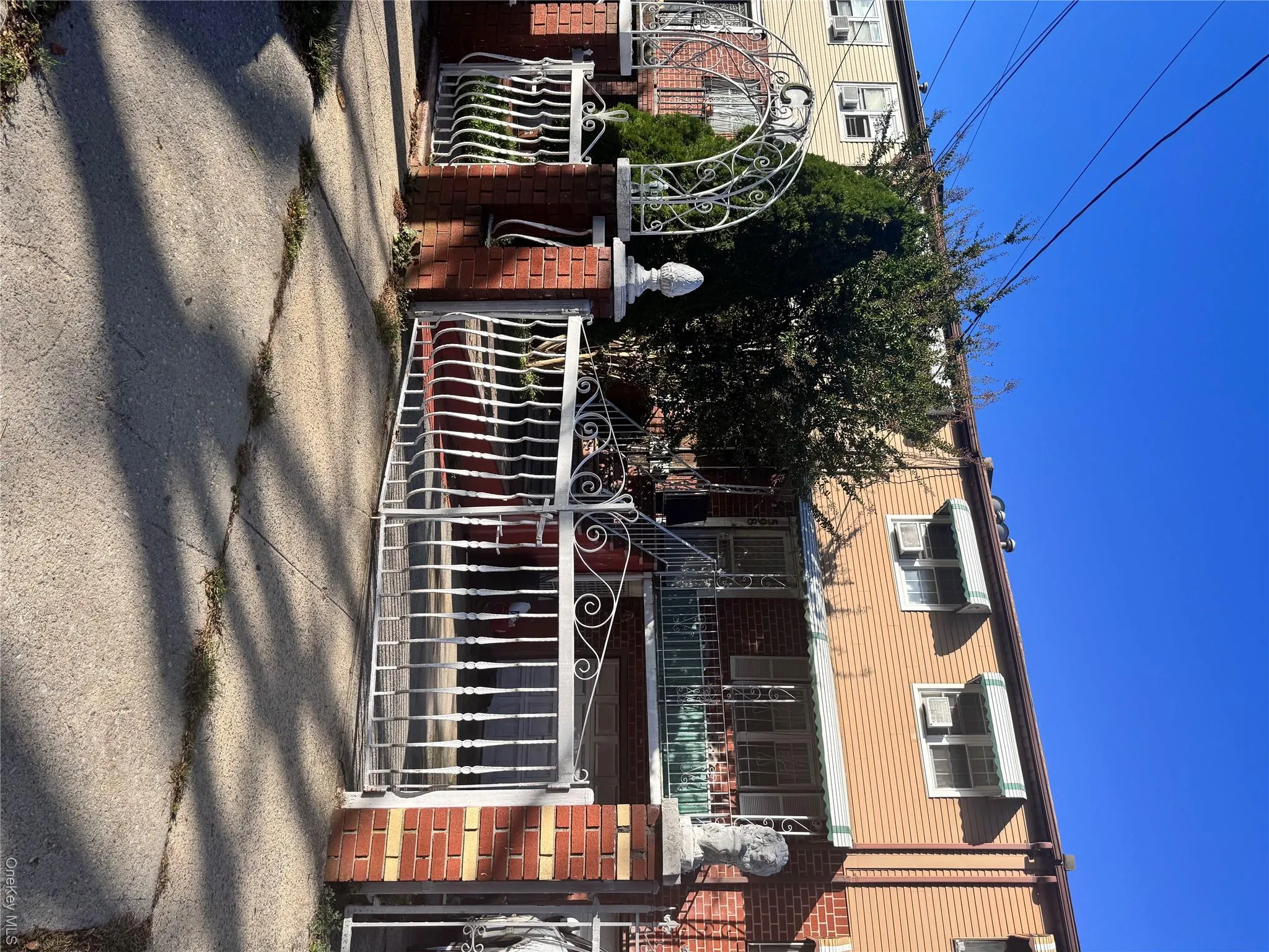 View of front facade featuring a gate View of front facade featuring a gate