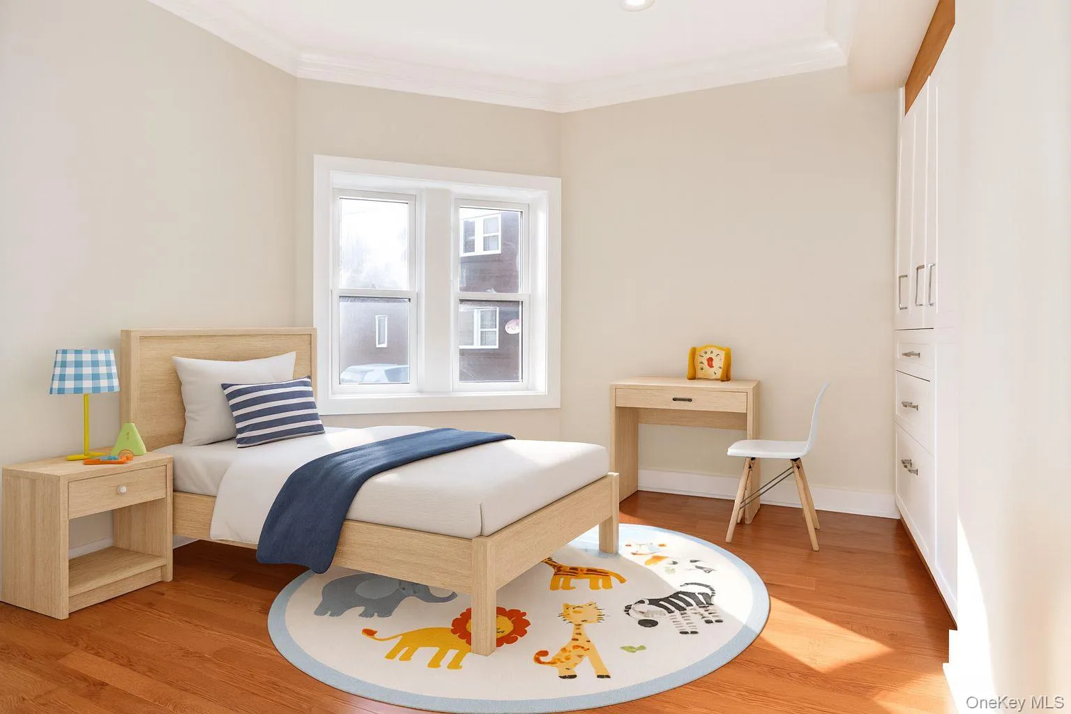 Bedroom featuring light wood finished floors and ornamental molding Bedroom featuring light wood finished floors and ornamental molding