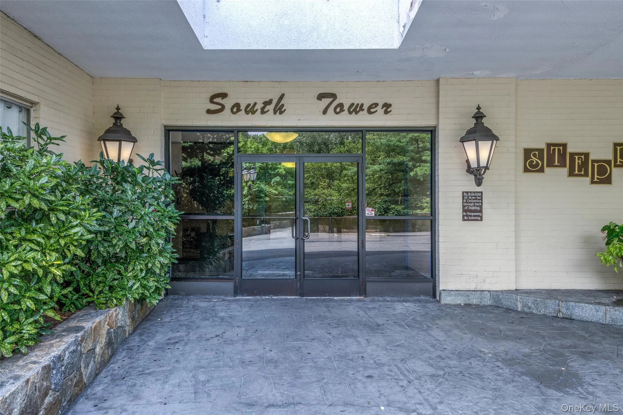 Doorway to property with brick siding Doorway to property with brick siding