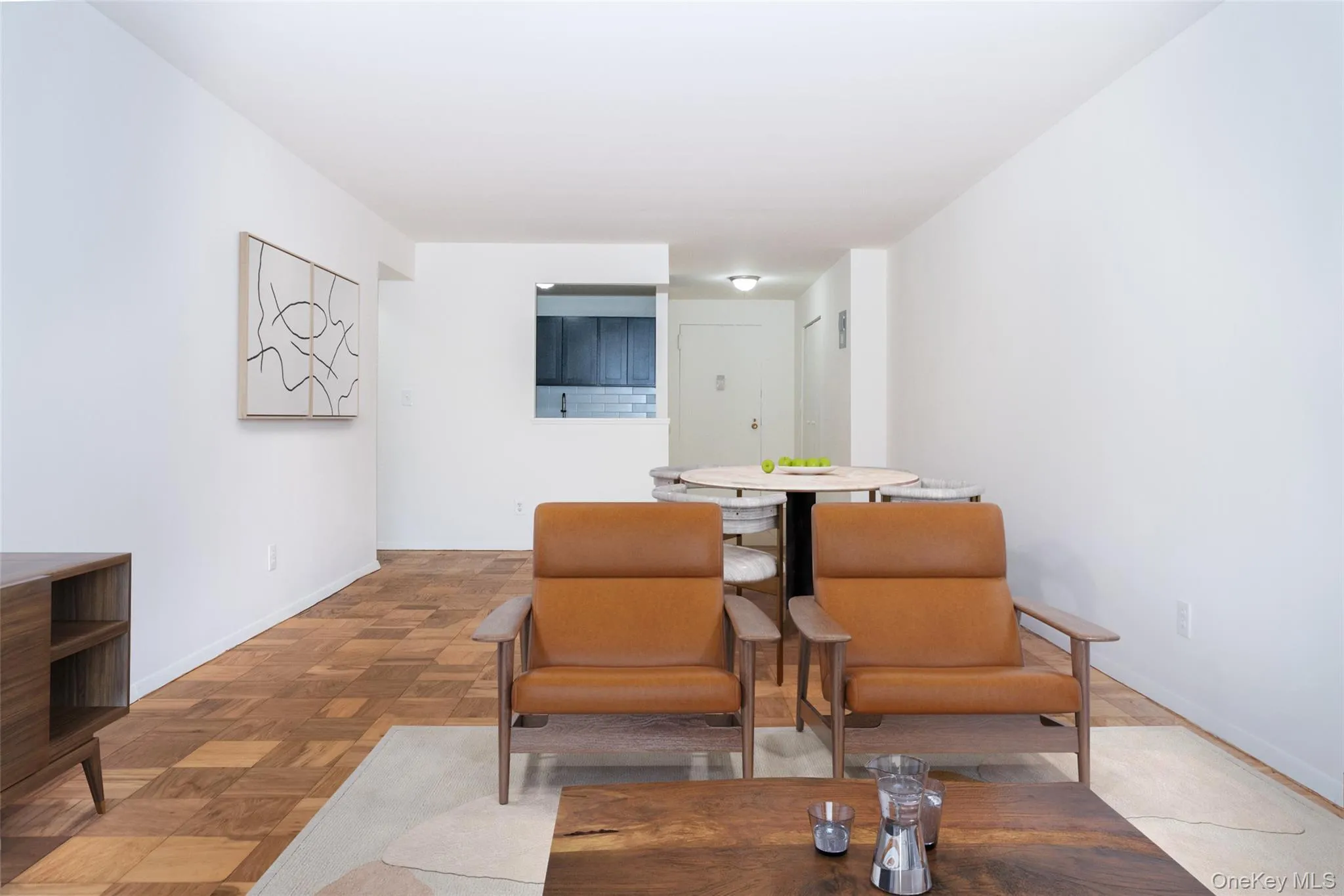 Living area featuring baseboards Living area featuring baseboards