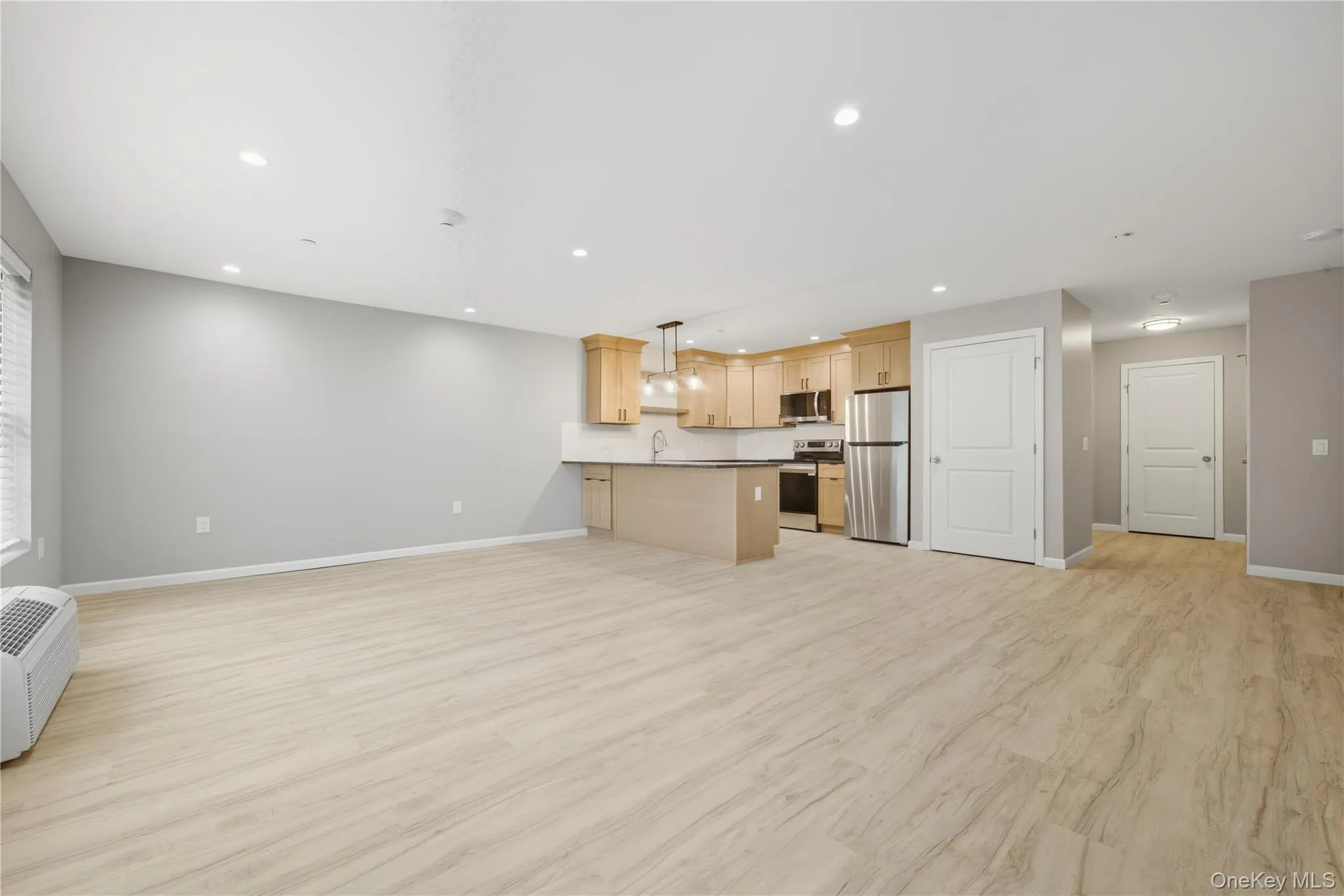 Open floor plan with Potential Dining Area, Luxury Vinyl Plank Flooring,  Recessed Lighting, and Ductless CAC & Heat Open floor plan with Potential Dining Area, Luxury Vinyl Plank Flooring,  Recessed Lighting, and Ductless CAC & Heat