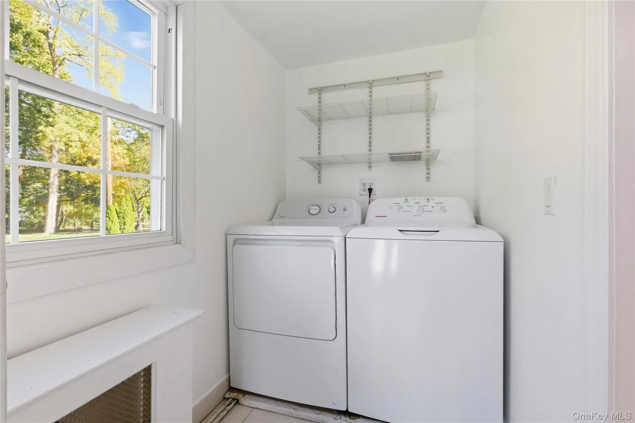 Laundry room featuring plenty of natural light and independent washer and dryer Laundry room featuring plenty of natural light and independent washer and dryer
