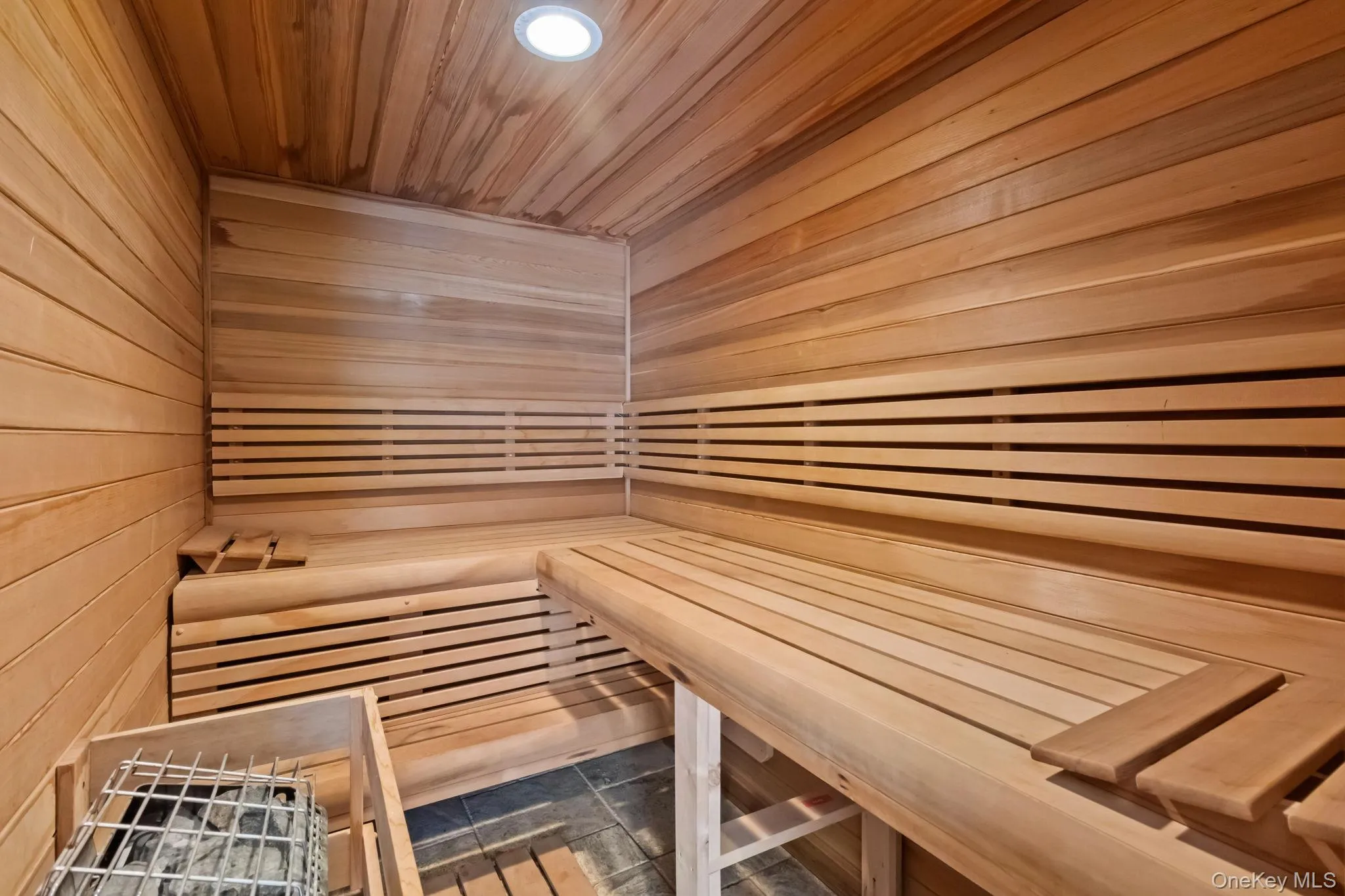 Sauna / steam room featuring wooden walls and wooden ceiling Sauna / steam room featuring wooden walls and wooden ceiling
