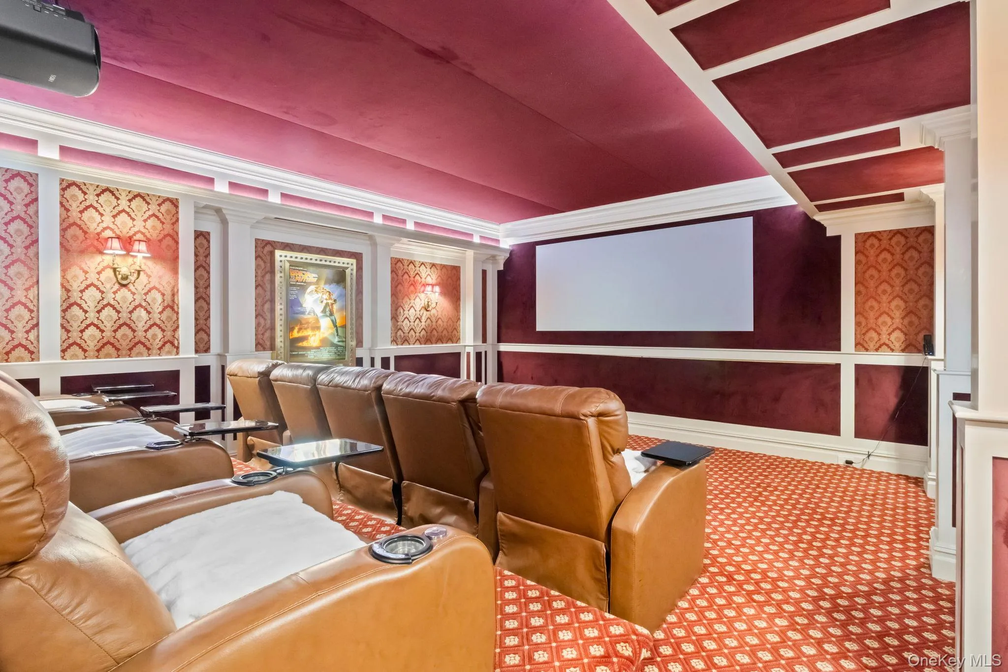 Cinema with a decorative wall, carpet, and ornamental molding Cinema with a decorative wall, carpet, and ornamental molding
