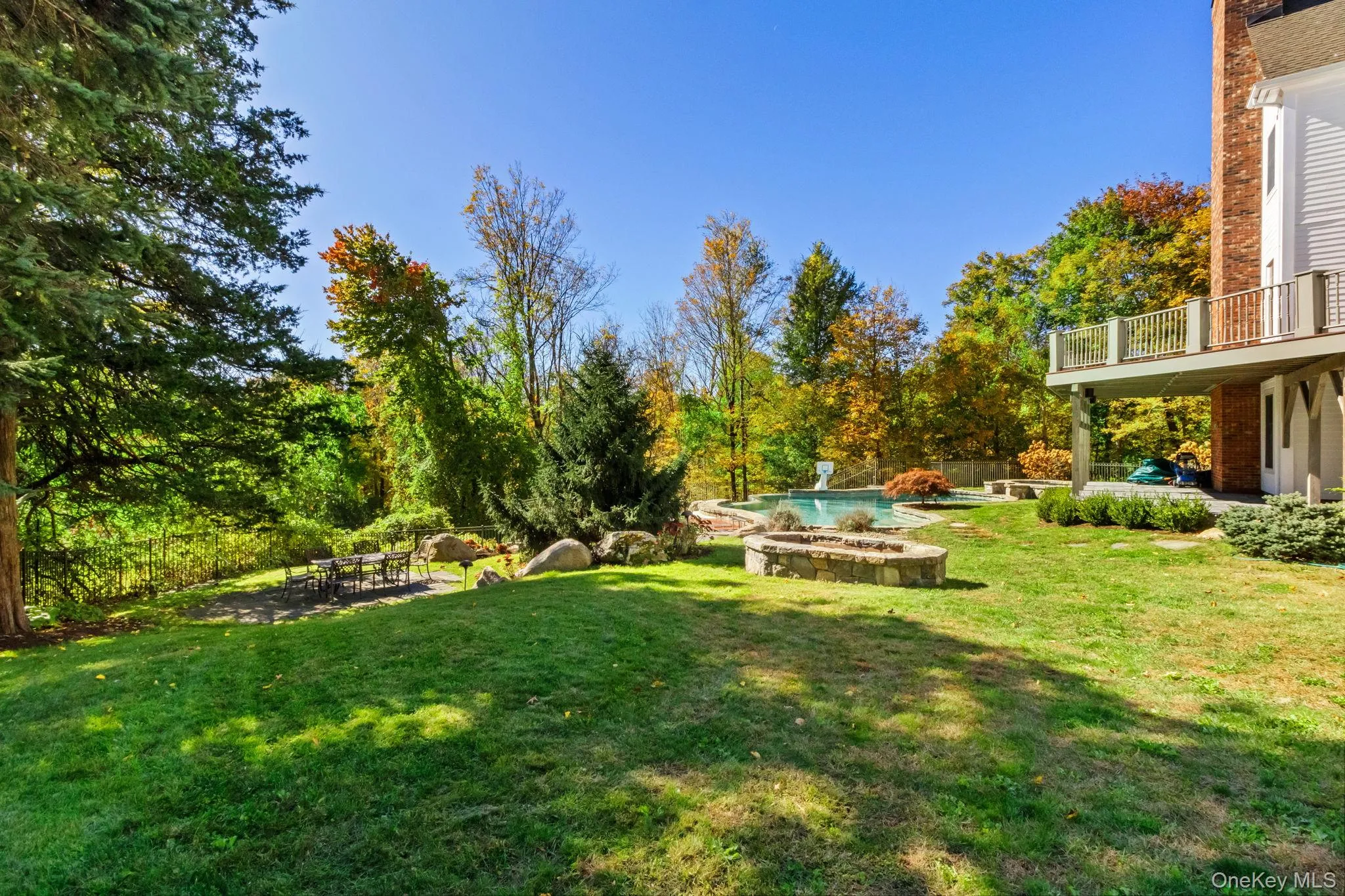 View of yard featuring a patio area and an outdoor pool View of yard featuring a patio area and an outdoor pool