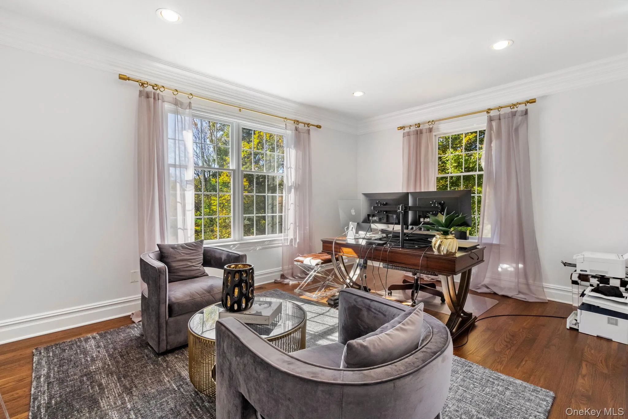 Office space featuring ornamental molding, wood finished floors, and recessed lighting Office space featuring ornamental molding, wood finished floors, and recessed lighting
