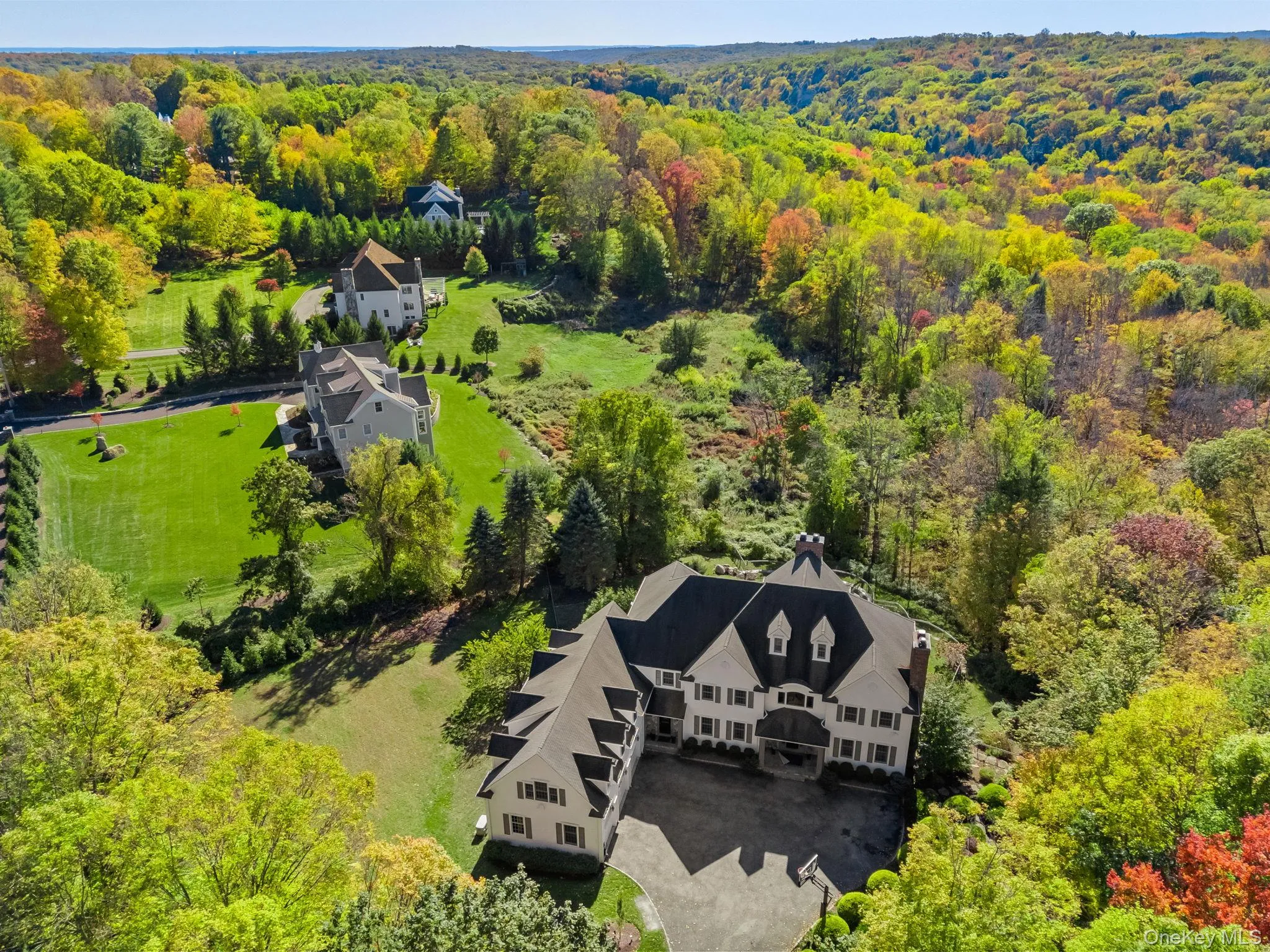 View from above of property with a heavily wooded area View from above of property with a heavily wooded area