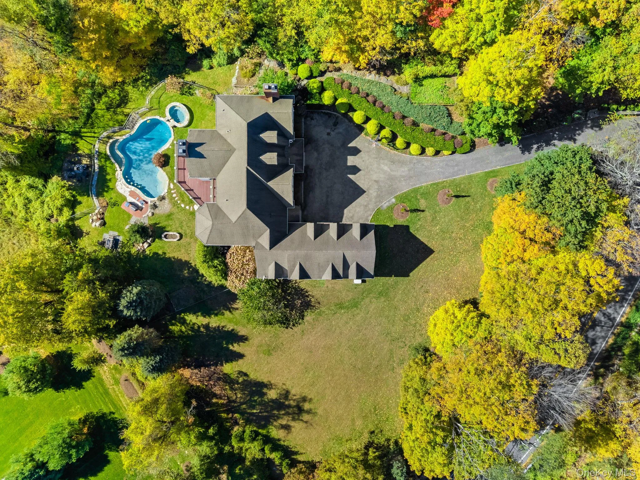 View of subject property featuring a pool area View of subject property featuring a pool area