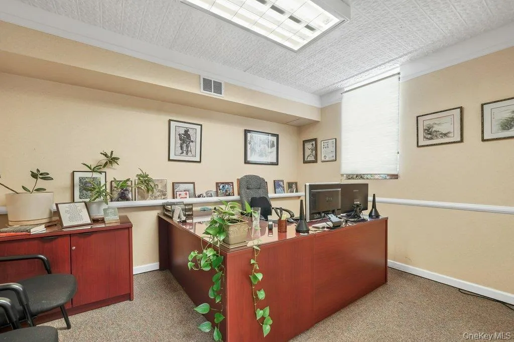 Office with ornamental molding and an ornate ceiling Office with ornamental molding and an ornate ceiling