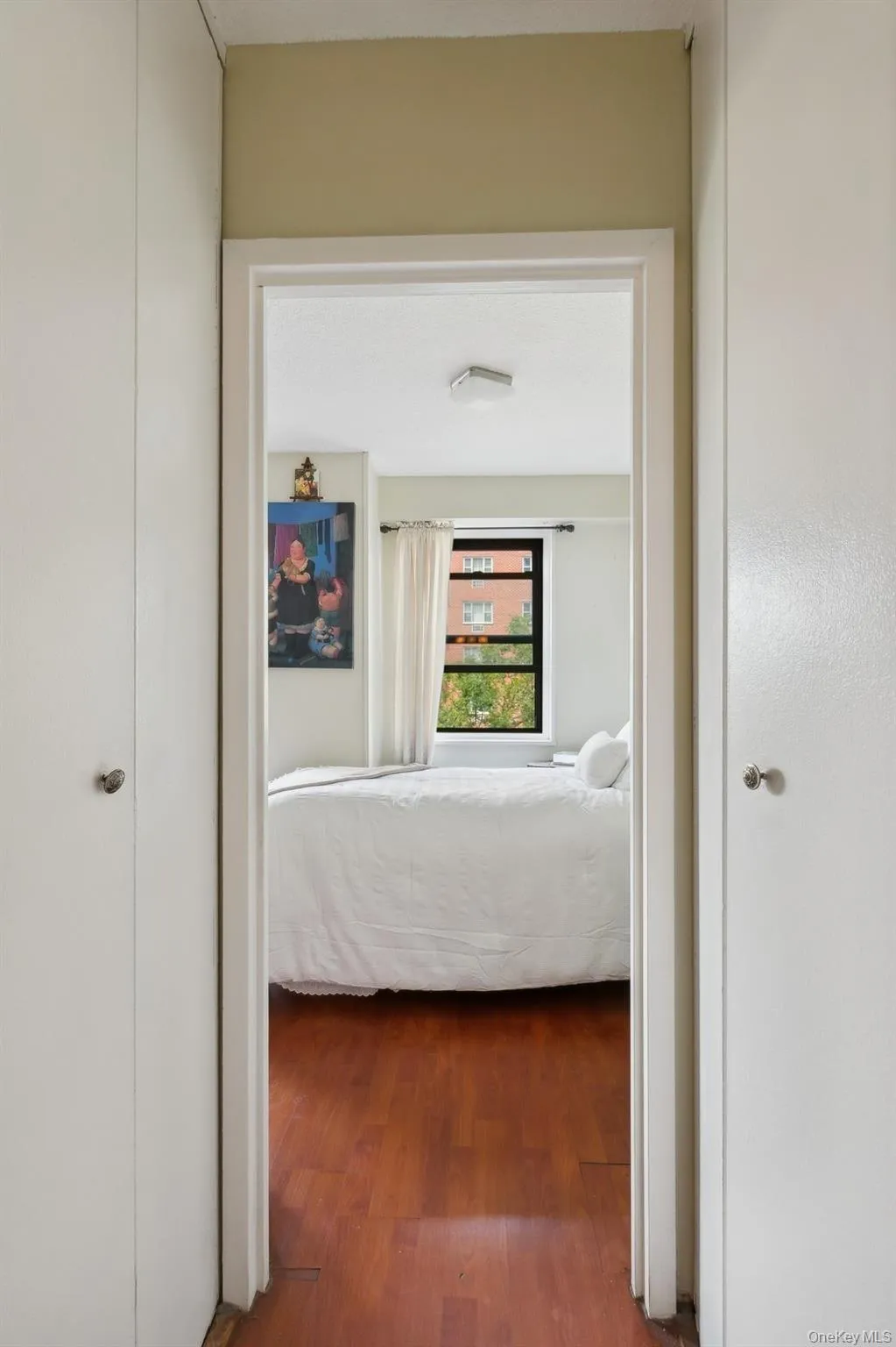 Hall featuring wood finished floors Hall featuring wood finished floors