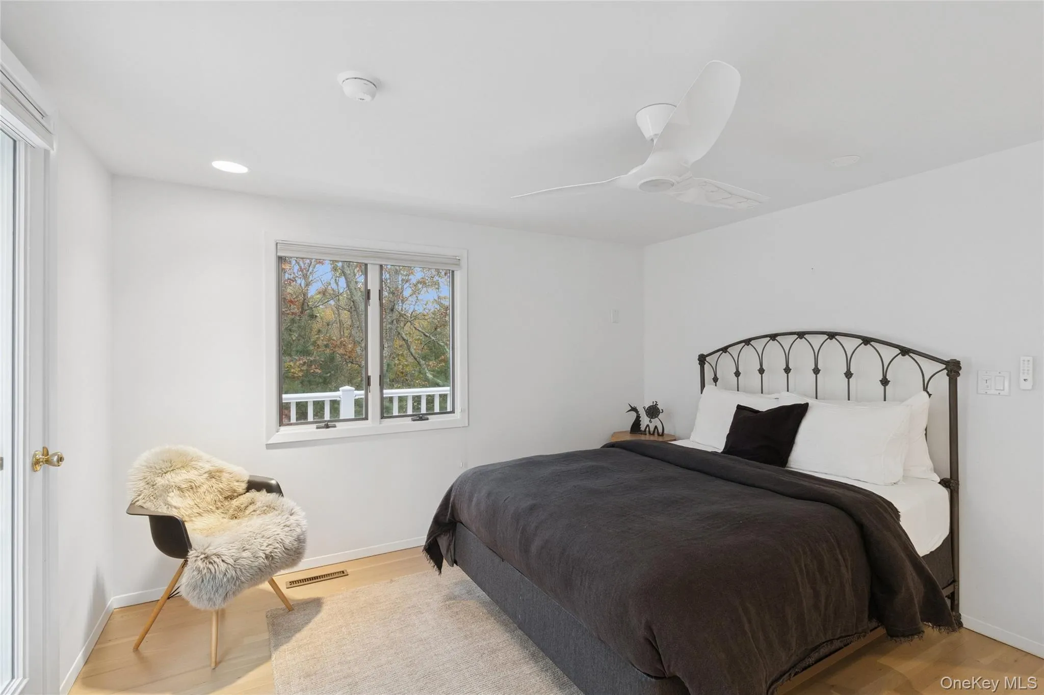 Bedroom with wood finished floors, a ceiling fan, and recessed lighting Bedroom with wood finished floors, a ceiling fan, and recessed lighting