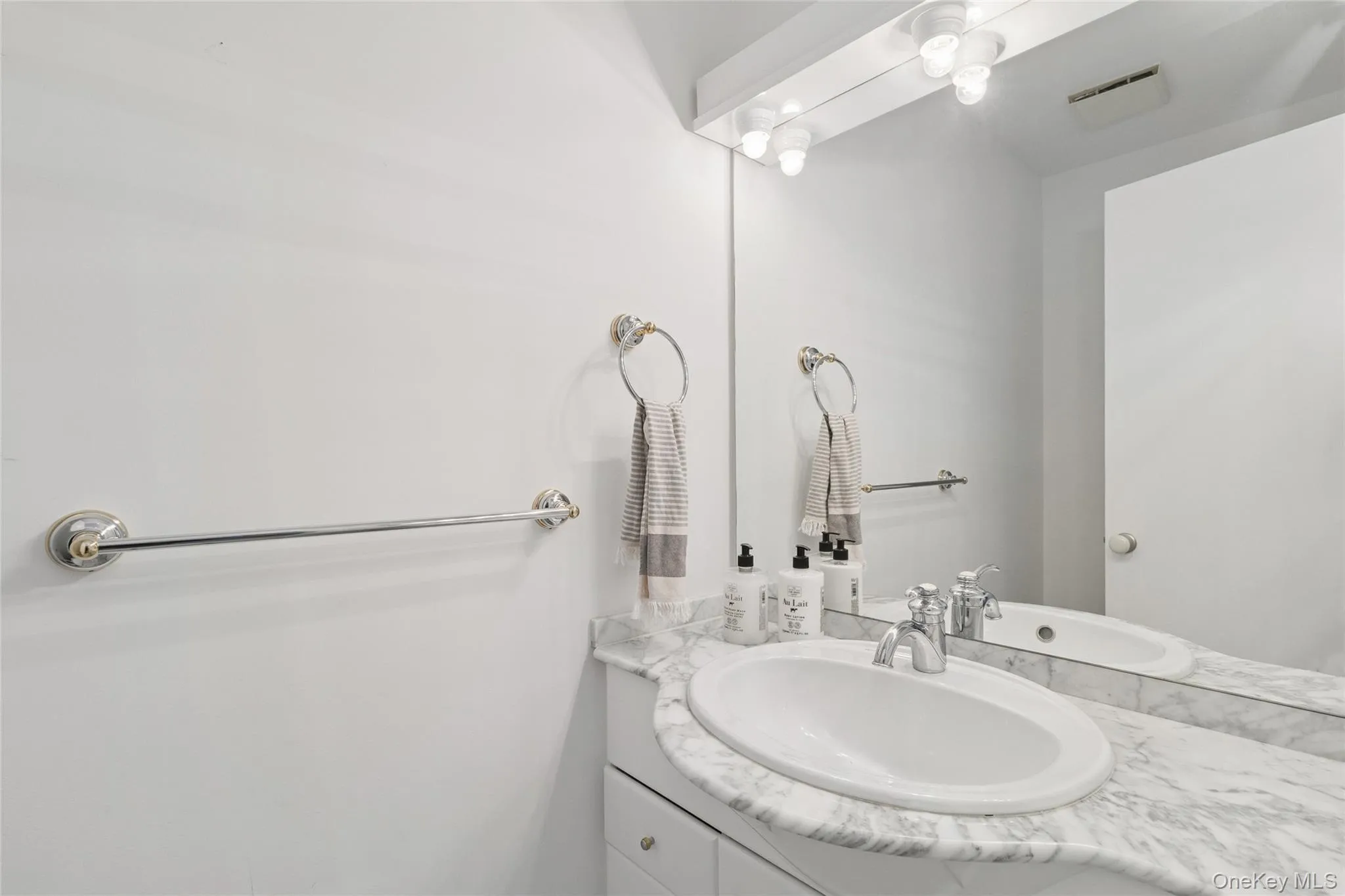 Bathroom featuring vanity Bathroom featuring vanity