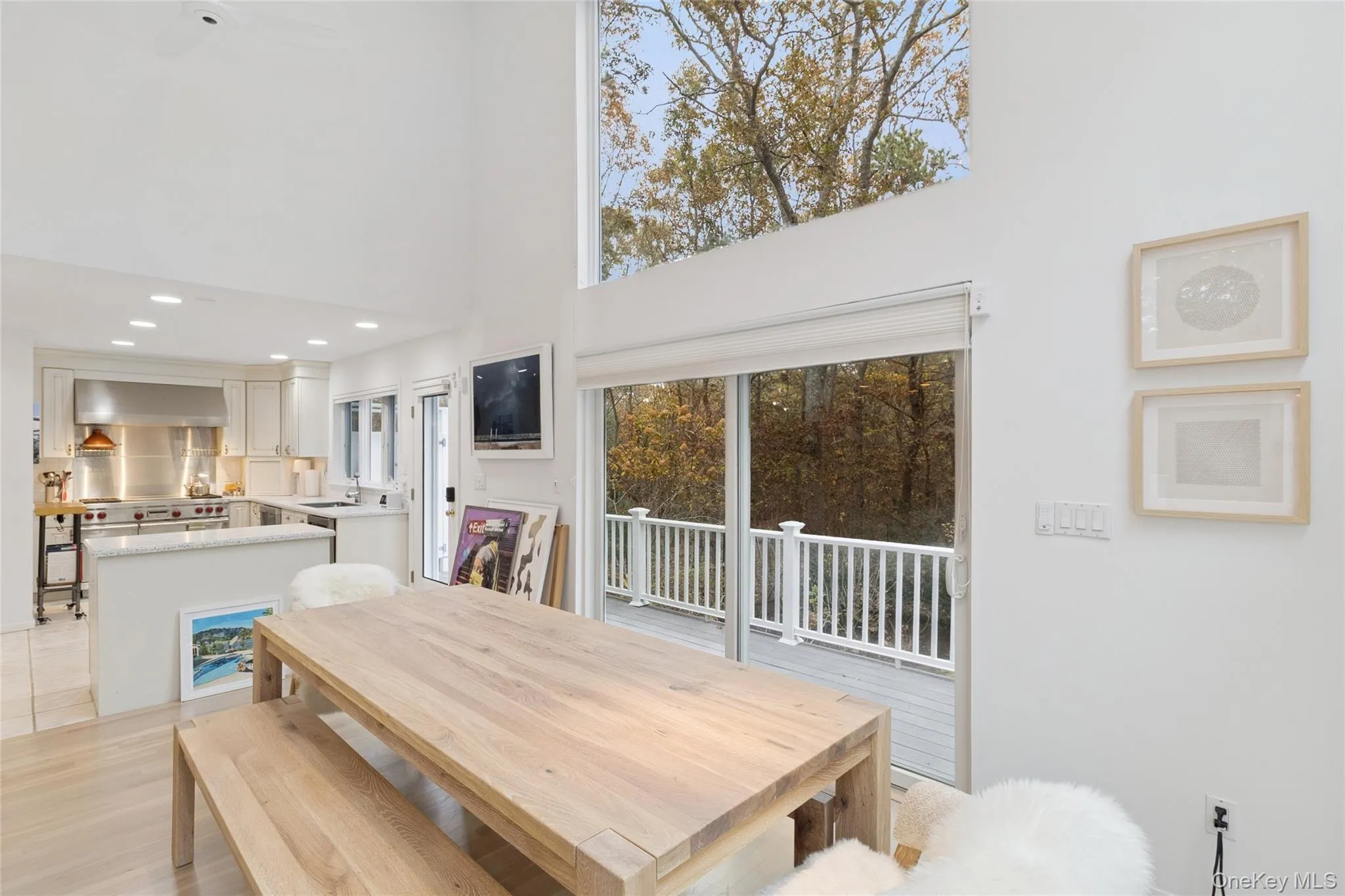 Dining room featuring a high ceiling and recessed lighting Dining room featuring a high ceiling and recessed lighting