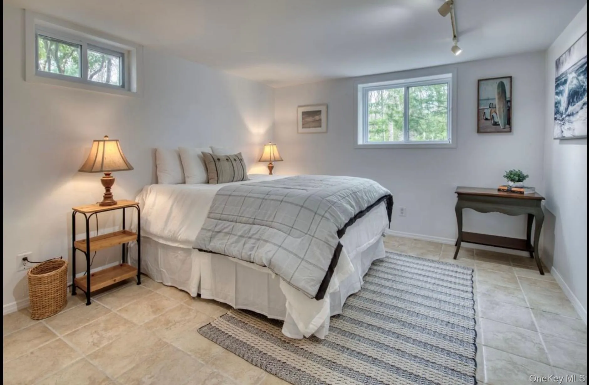 Bedroom featuring baseboards and track lighting Bedroom featuring baseboards and track lighting