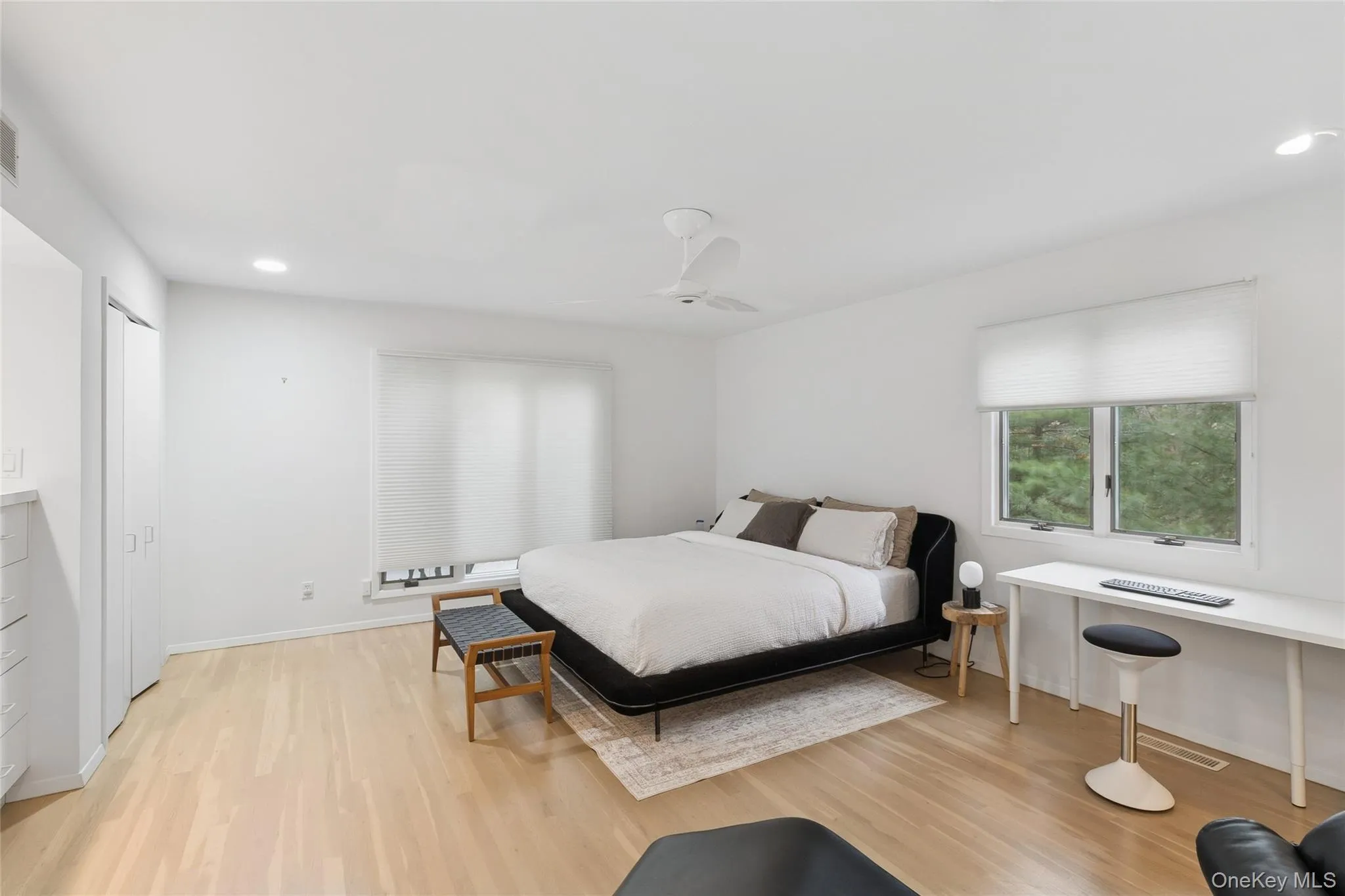 Bedroom with recessed lighting, light wood finished floors, and ceiling fan Bedroom with recessed lighting, light wood finished floors, and ceiling fan