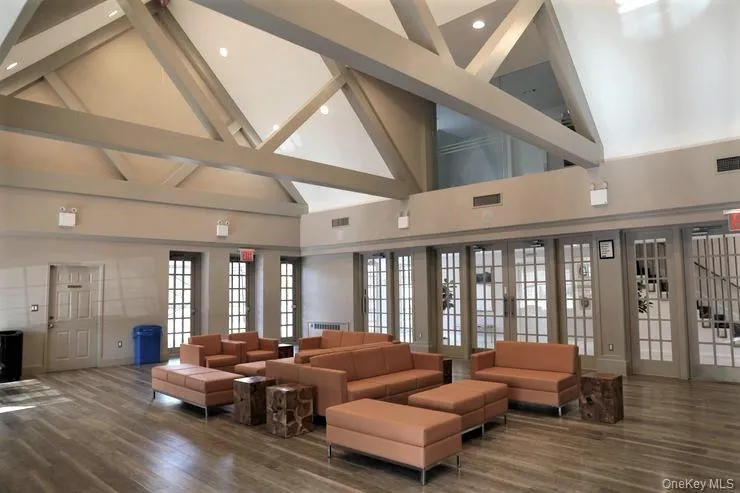 Clubhouse Lounge with high vaulted ceiling and beam ceiling Clubhouse Lounge with high vaulted ceiling and beam ceiling