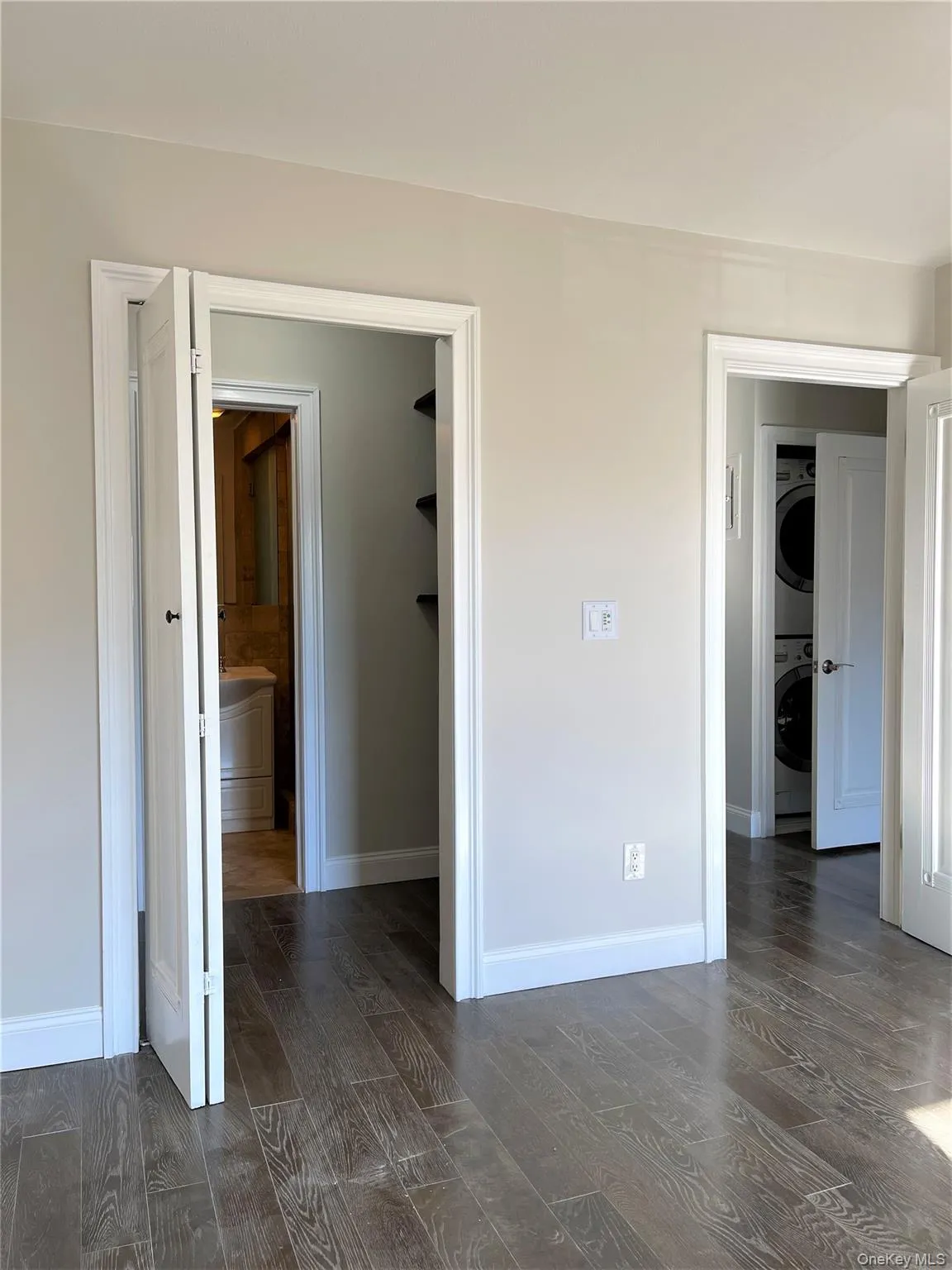 Bedroom with a walk-in closet and primary bathroom Bedroom with a walk-in closet and primary bathroom