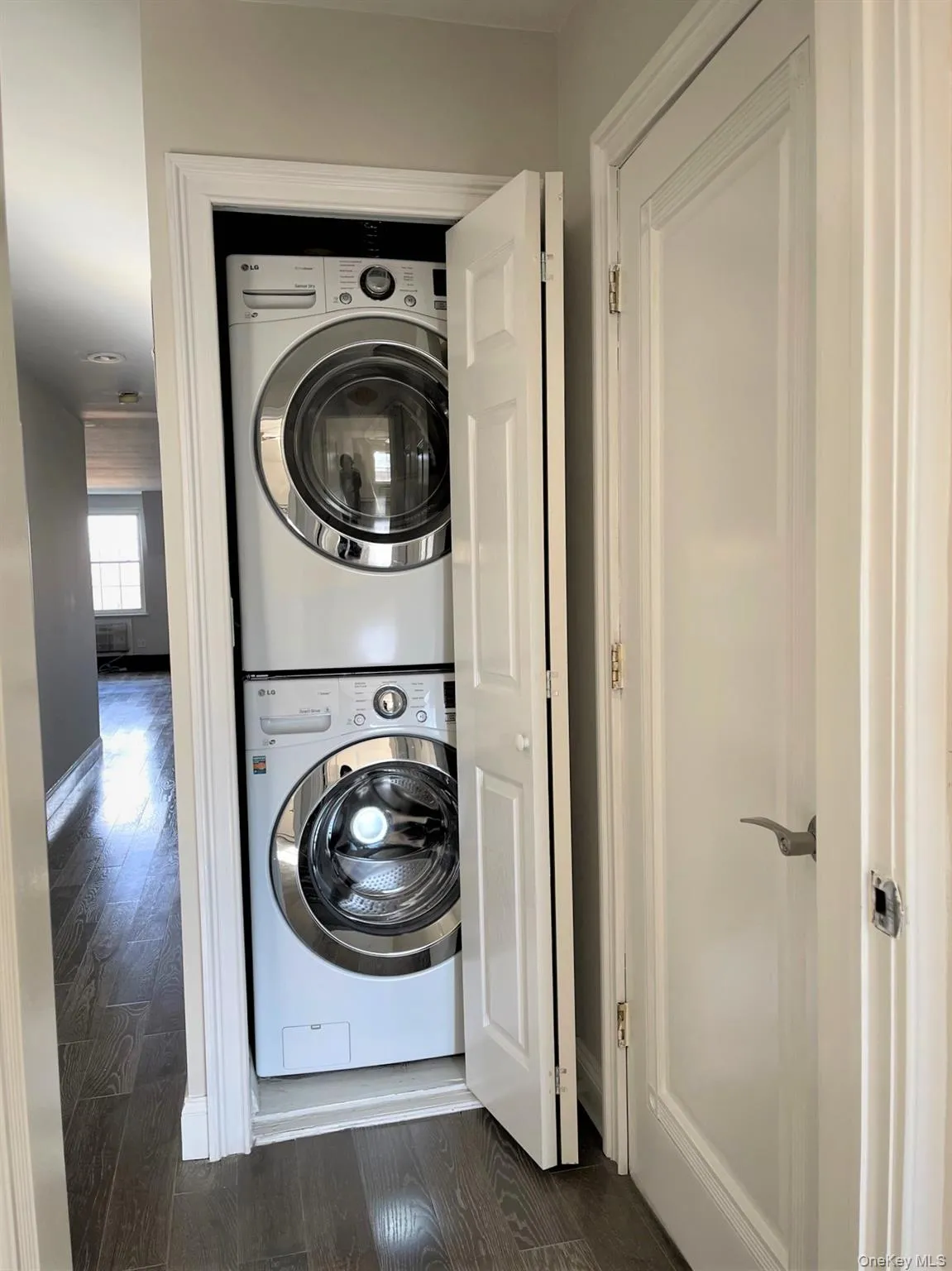 Laundry area with stacked washer / drying machine Laundry area with stacked washer / drying machine