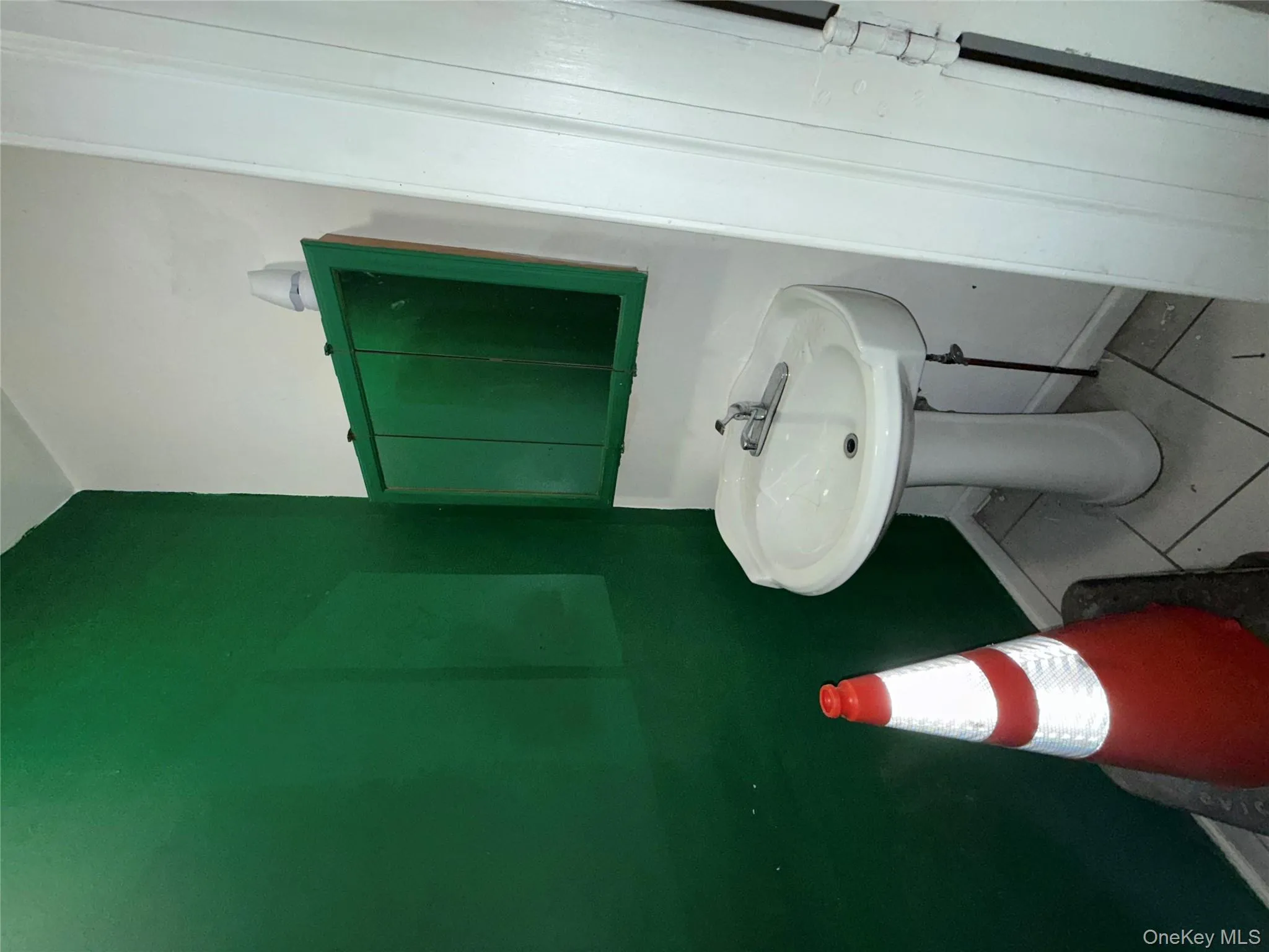 Bathroom with tile patterned flooring and baseboards Bathroom with tile patterned flooring and baseboards