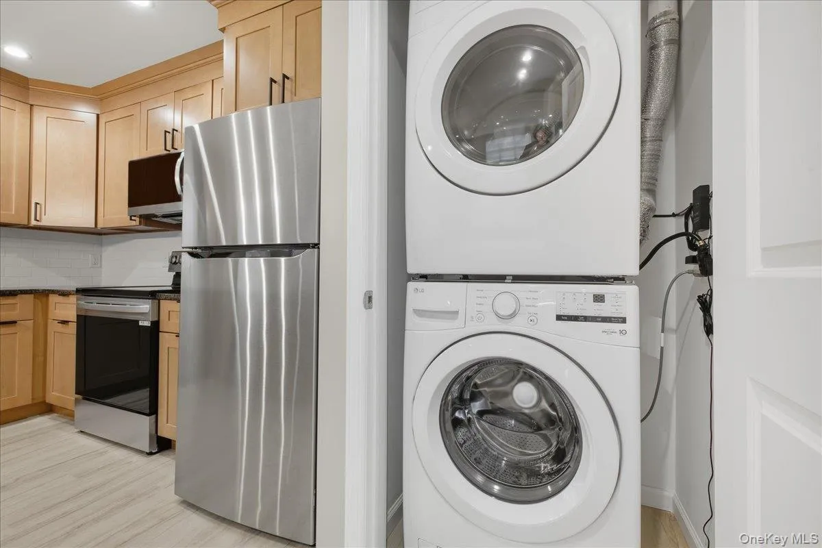 Laundry Area with Stacked Washer / Dryer Laundry Area with Stacked Washer / Dryer