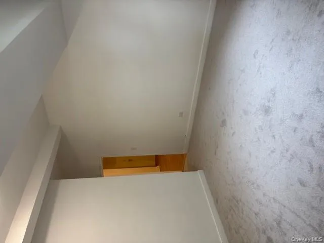 Unfurnished room featuring baseboards and light carpet Unfurnished room featuring baseboards and light carpet