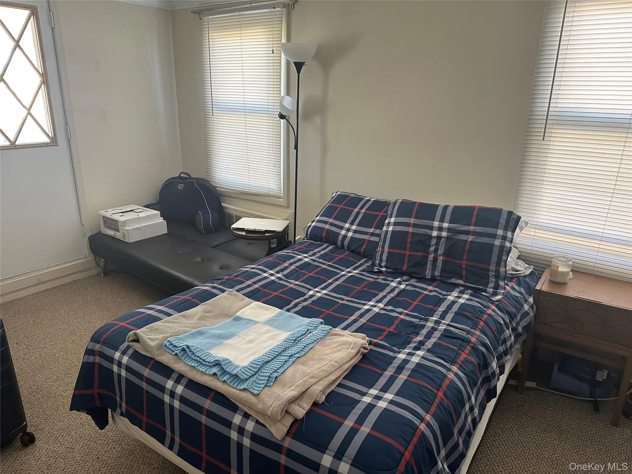 Bedroom with carpet flooring Bedroom with carpet flooring