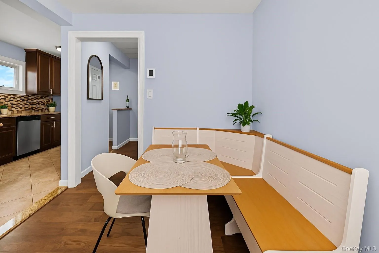 Dining area featuring dark wood-style floors and baseboards Dining area featuring dark wood-style floors and baseboards