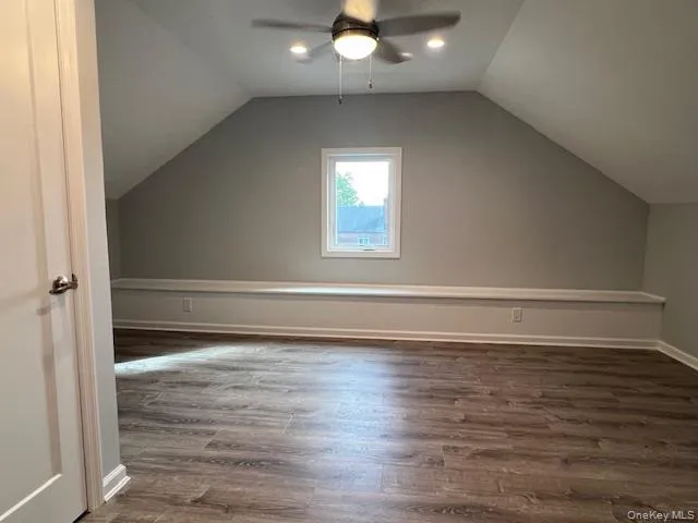 Bonus room with wood finished floors, vaulted ceiling, and ceiling fan Bonus room with wood finished floors, vaulted ceiling, and ceiling fan