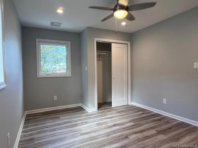 master bedroom with full bathroom with finished wooden floors, a ceiling fan, a closet, and recessed lighting master bedroom with full bathroom with finished wooden floors, a ceiling fan, a closet, and recessed lighting