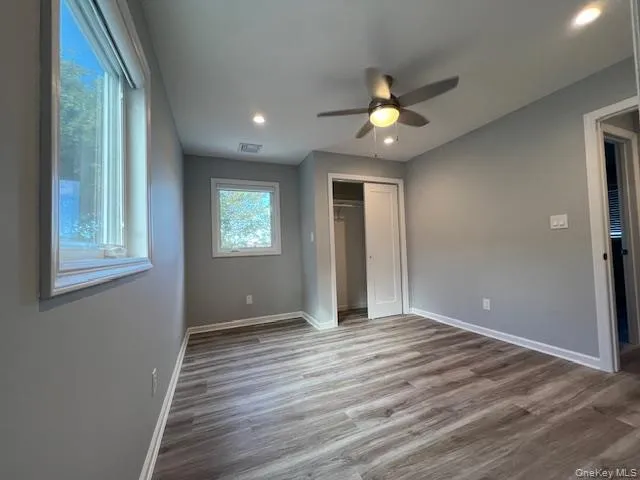 Unfurnished bedroom with light wood finished floors, recessed lighting, a closet, and ceiling fan Unfurnished bedroom with light wood finished floors, recessed lighting, a closet, and ceiling fan