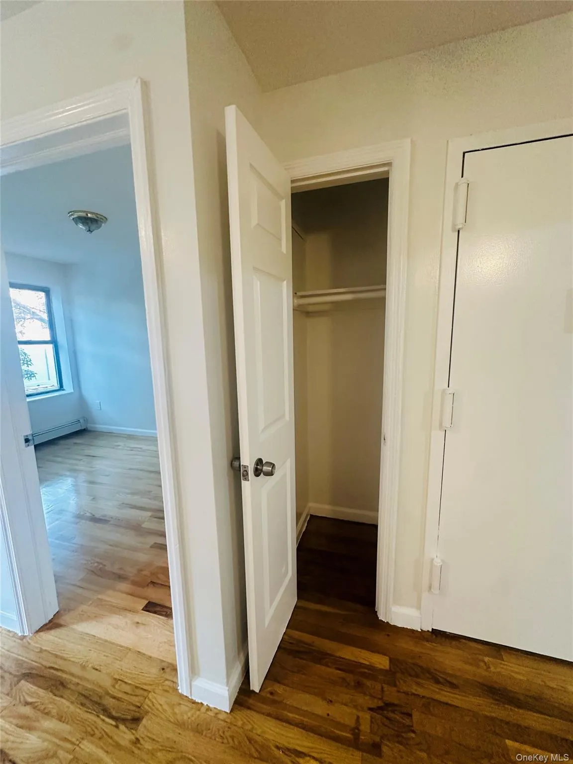 Closet featuring a baseboard radiator Closet featuring a baseboard radiator