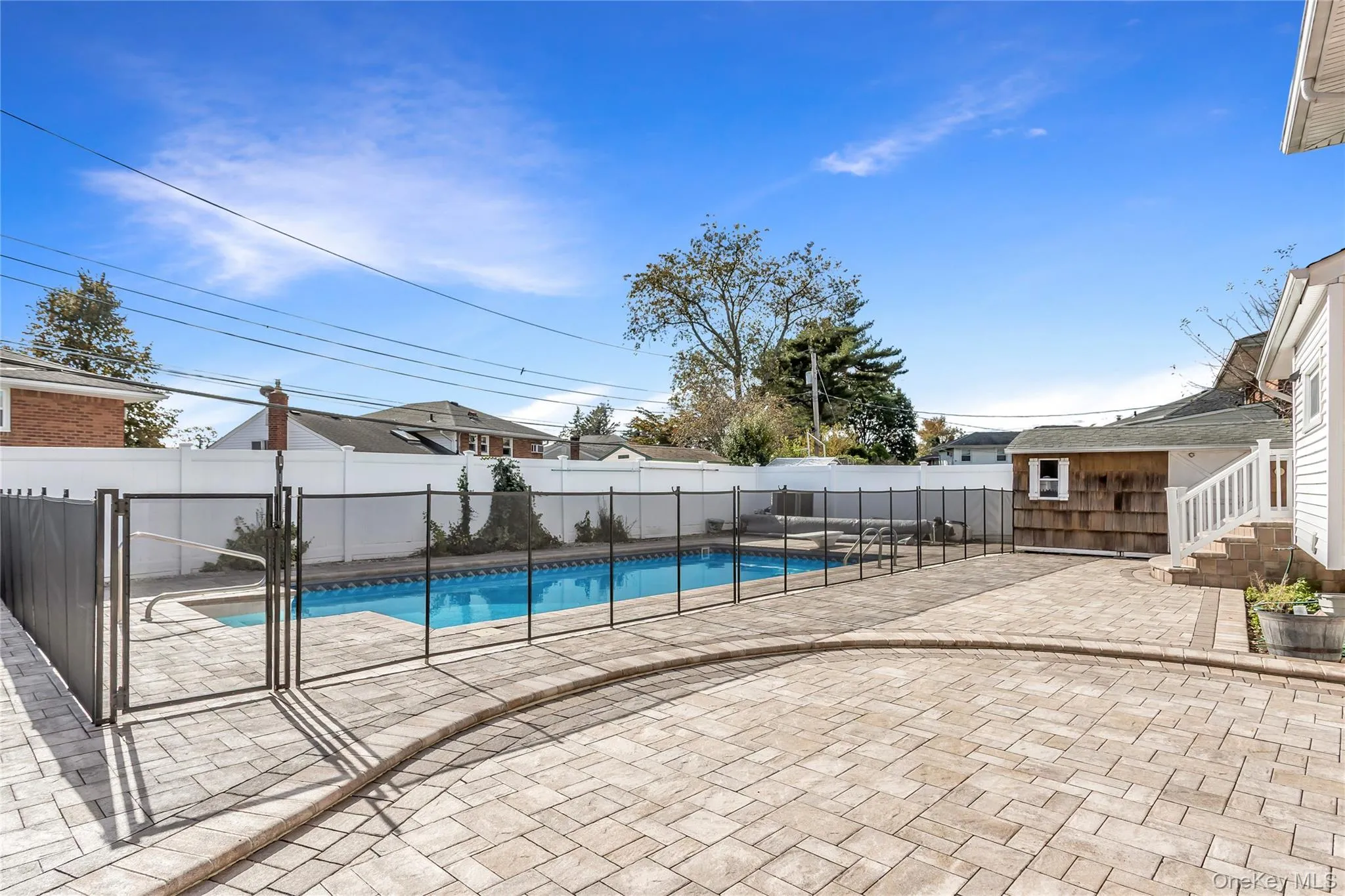 View of pool featuring a patio area and a fenced backyard View of pool featuring a patio area and a fenced backyard