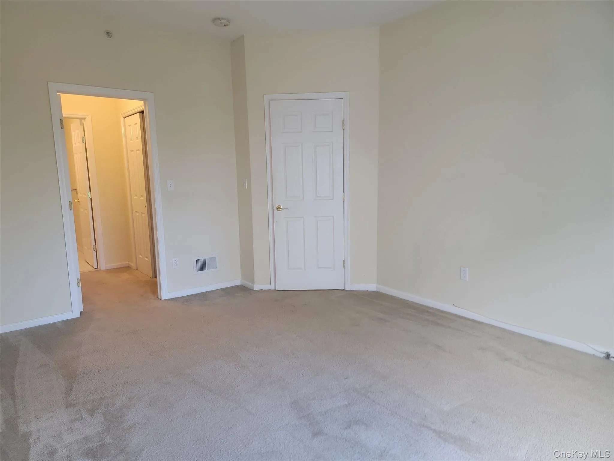 Unfurnished bedroom with carpet and baseboards Unfurnished bedroom with carpet and baseboards