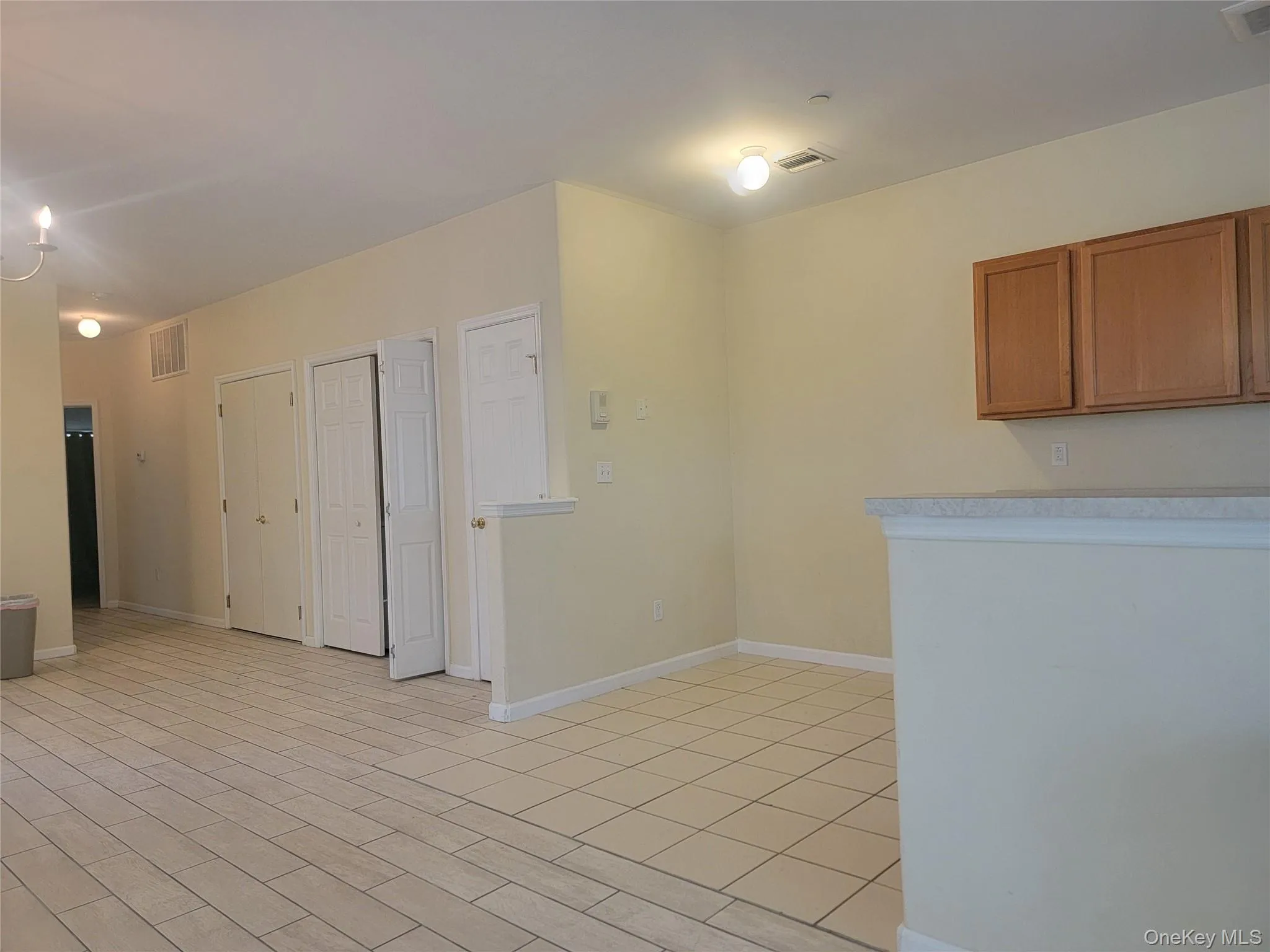 Unfurnished room with baseboards and light wood-style flooring Unfurnished room with baseboards and light wood-style flooring