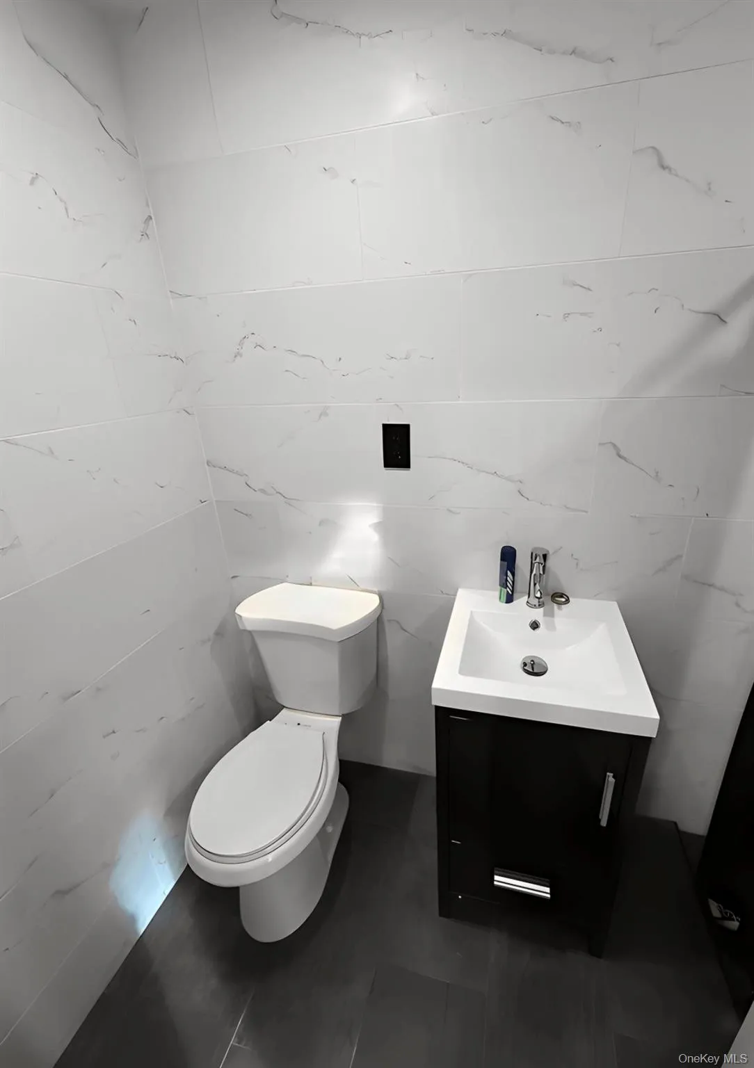 Bathroom with vanity and tile walls Bathroom with vanity and tile walls