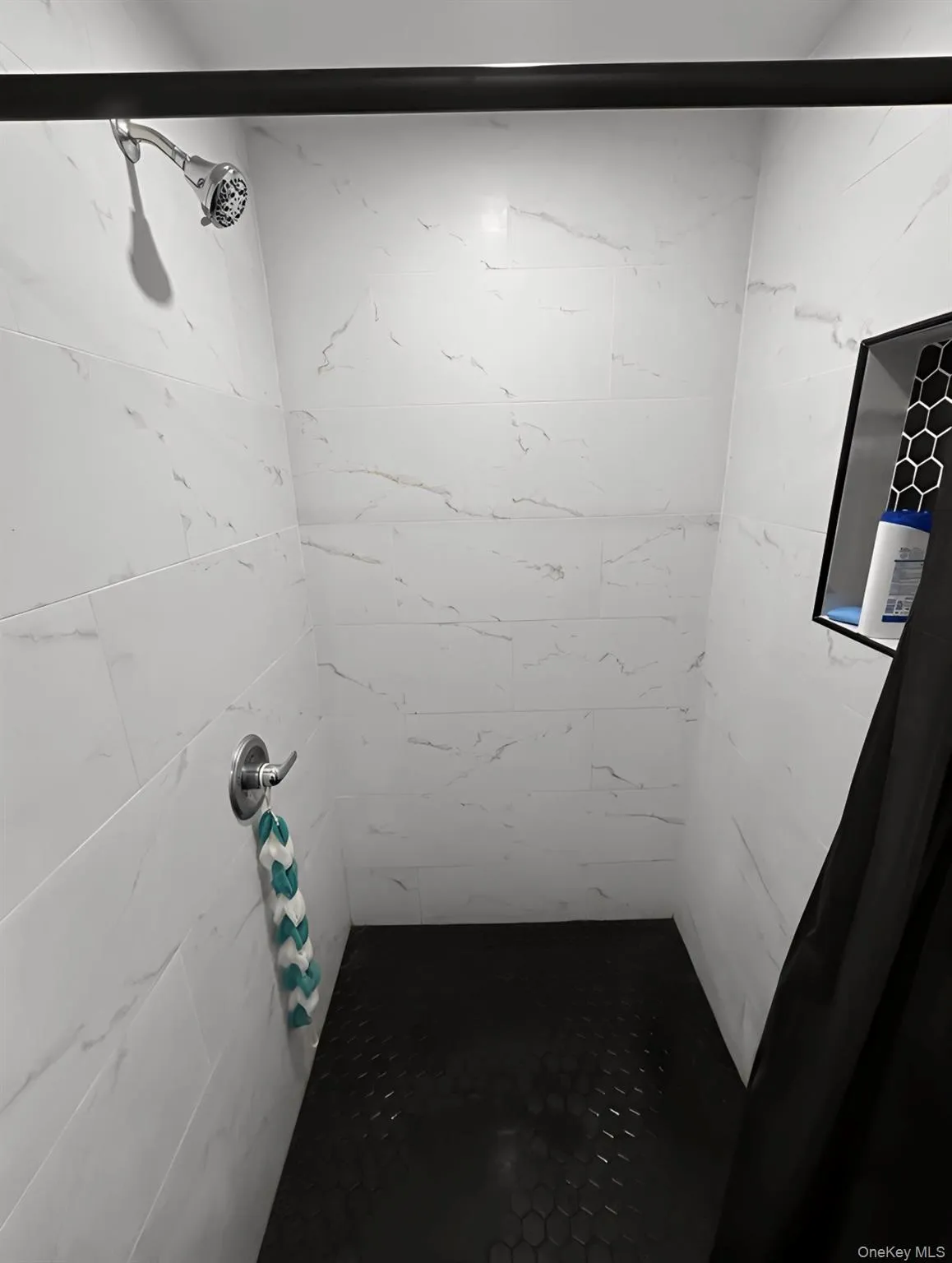 Bathroom featuring a shower stall Bathroom featuring a shower stall