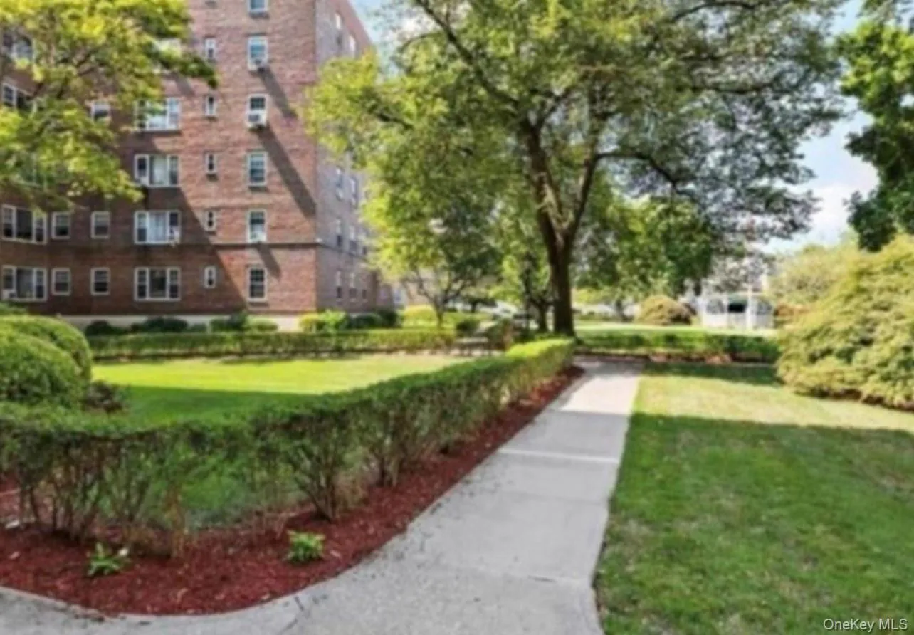 View of home's community with a lawn View of home's community with a lawn