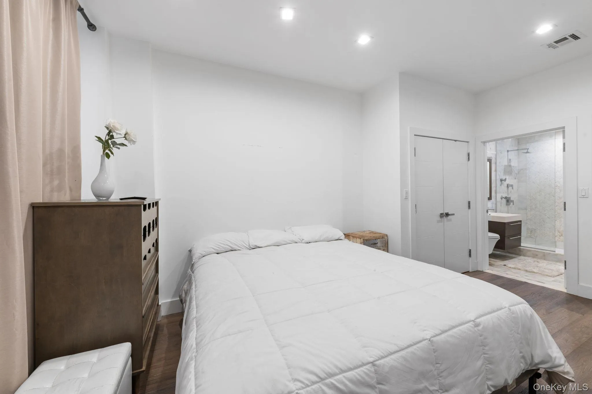 Bedroom featuring dark wood-type flooring, a closet, recessed lighting, and ensuite bathroom Bedroom featuring dark wood-type flooring, a closet, recessed lighting, and ensuite bathroom